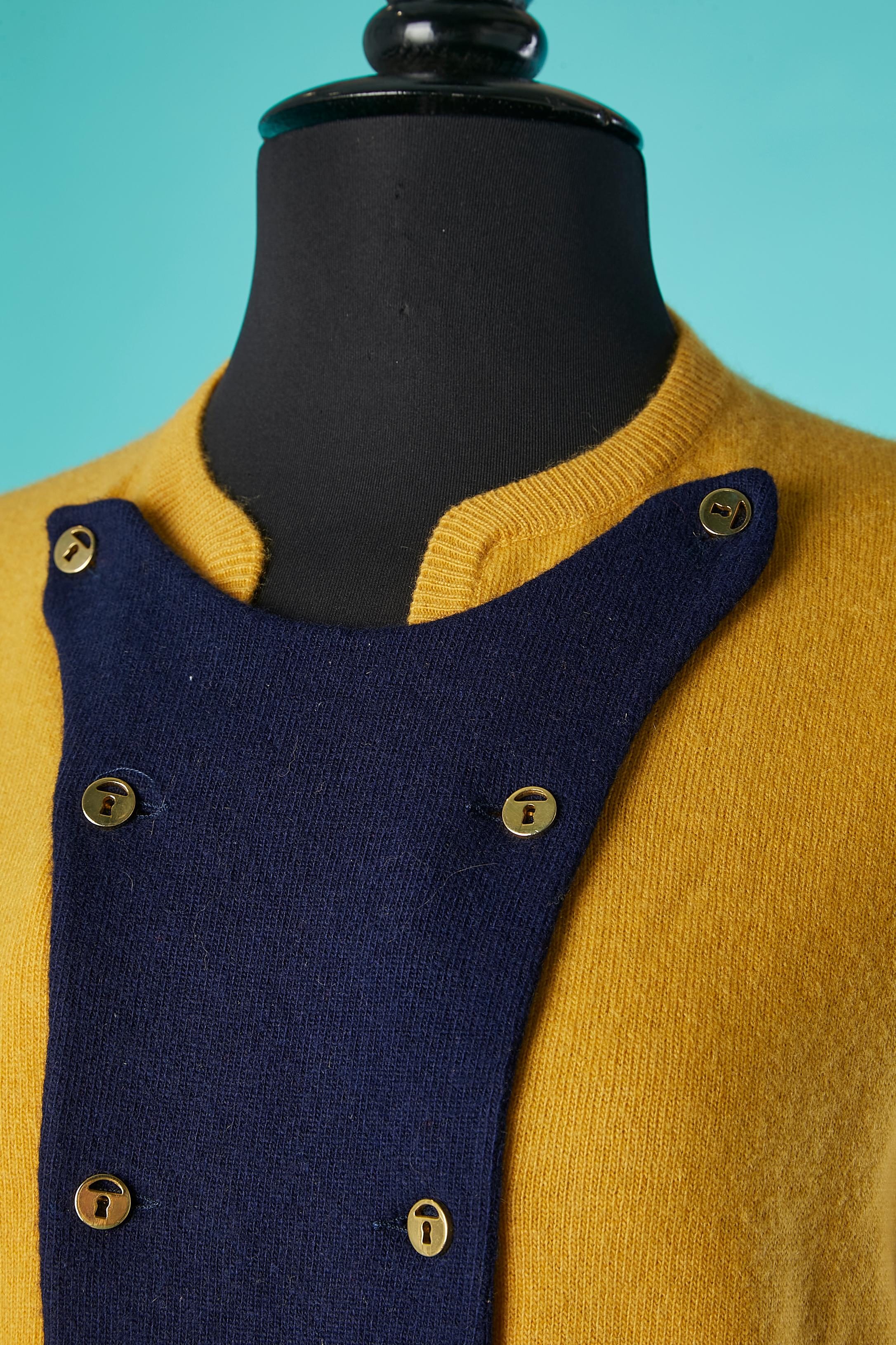 Mustard and navy cashmere knit Trompe-l'oeil cardigan. Double line of gold buttons in the front. 
Scotish cashmere. 
SIZE M 