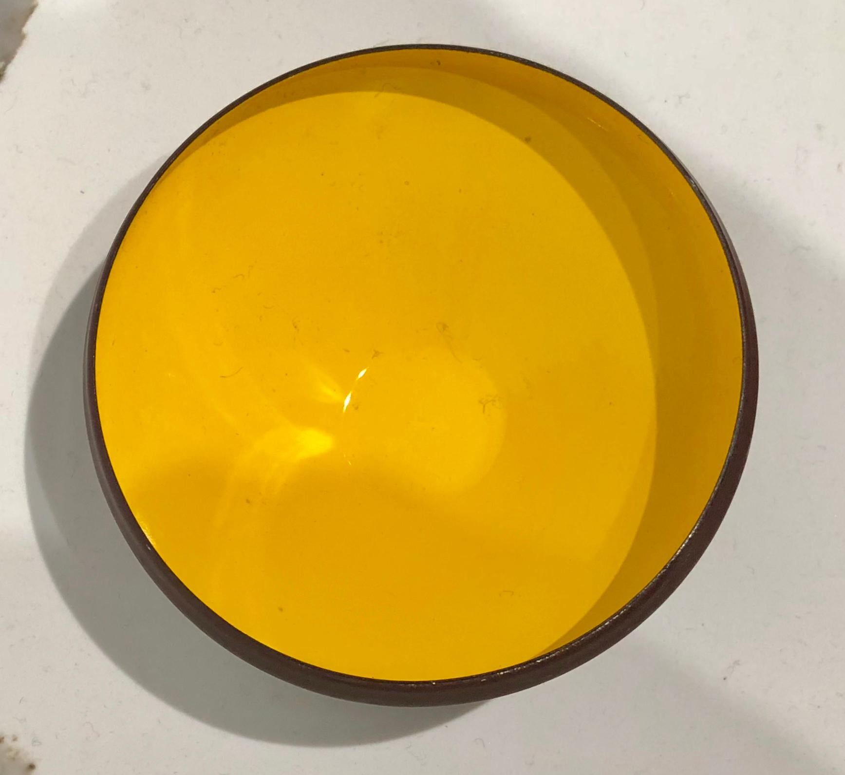 Beautiful shape and nice condition on this mustard and brown combo enameled bowl, circa 1950s nice shape great accent piece , with its original made in Denmark label.