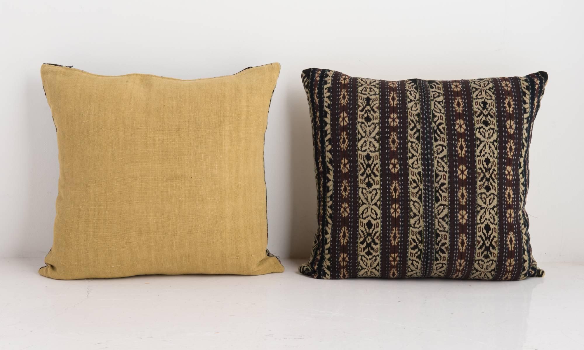 Mustard and brown ikat cushions, circa 1950

Thick traditional ikat weave in mustard, brown and black with zip closure and feather pads.