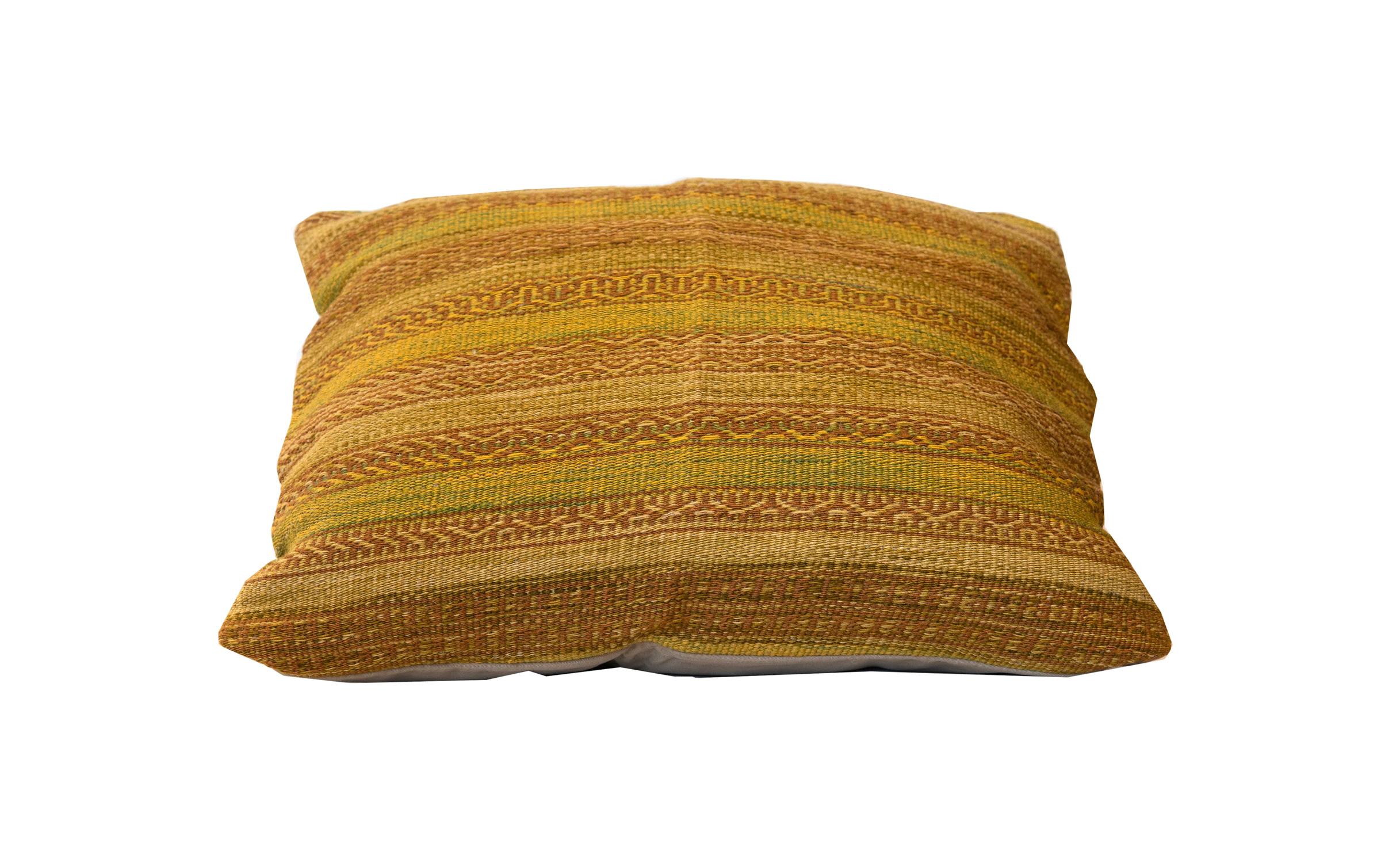 This fine wool cushion features a simple stripe design with various brown and cream stripes. They are woven intricately with geometric patterns through the strip. This unique cushion's colour, texture, and design are sure to make the perfect accent