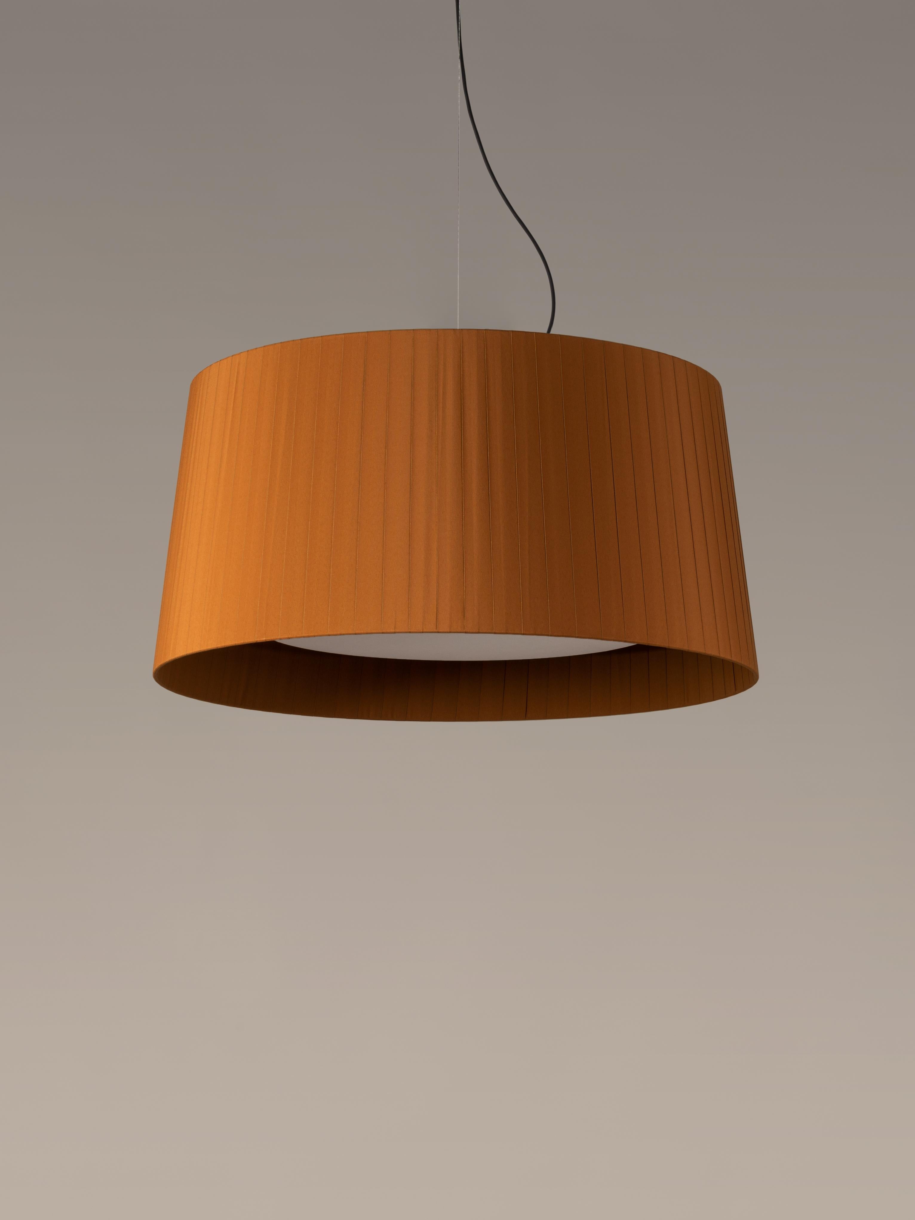 Mustard GT7 pendant lamp by Santa & Cole.
Dimensions: D 90 x H 44 cm.
Materials: Metal, ribbon.
Available in other colors.

Designed for intermediate volumes and domestic areas, GT7 is larger, requiring a reinforced structure that adds a metal