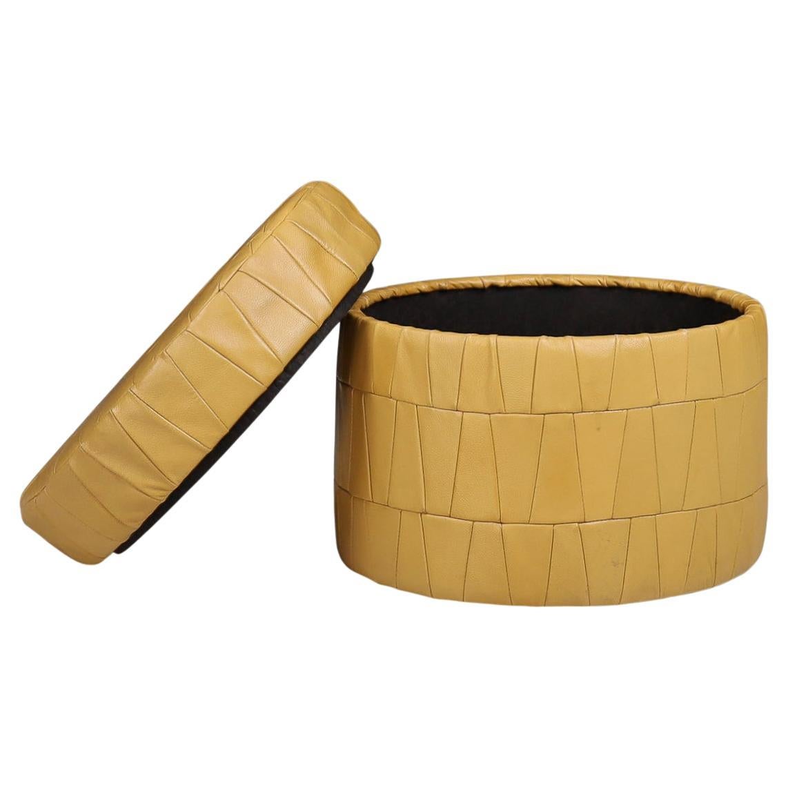 Mustard patchwork leather round storage ottoman by De Sede, Switzerland, 1970s.