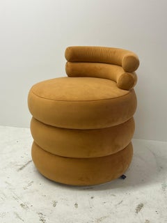 Mustard velvet rounded puff lounge chair, sculptural and contemporary low seat