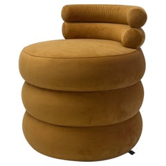 Mustard velvet rounded puff lounge chair, sculptural and contemporary low seat