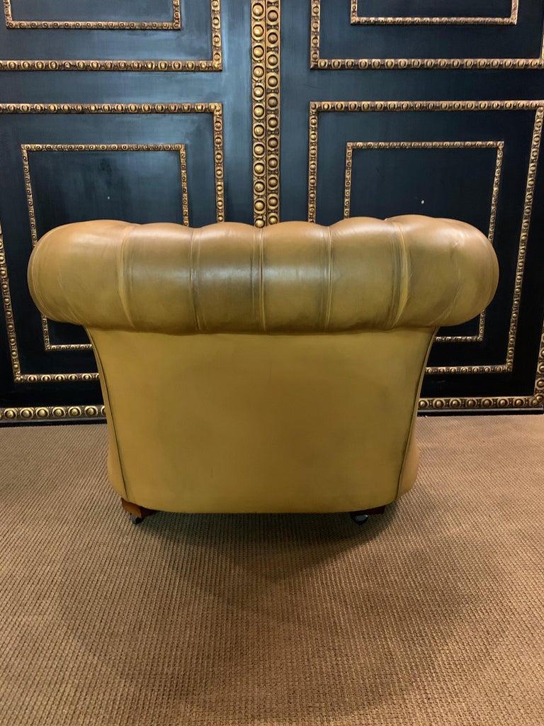 yellow chesterfield armchair