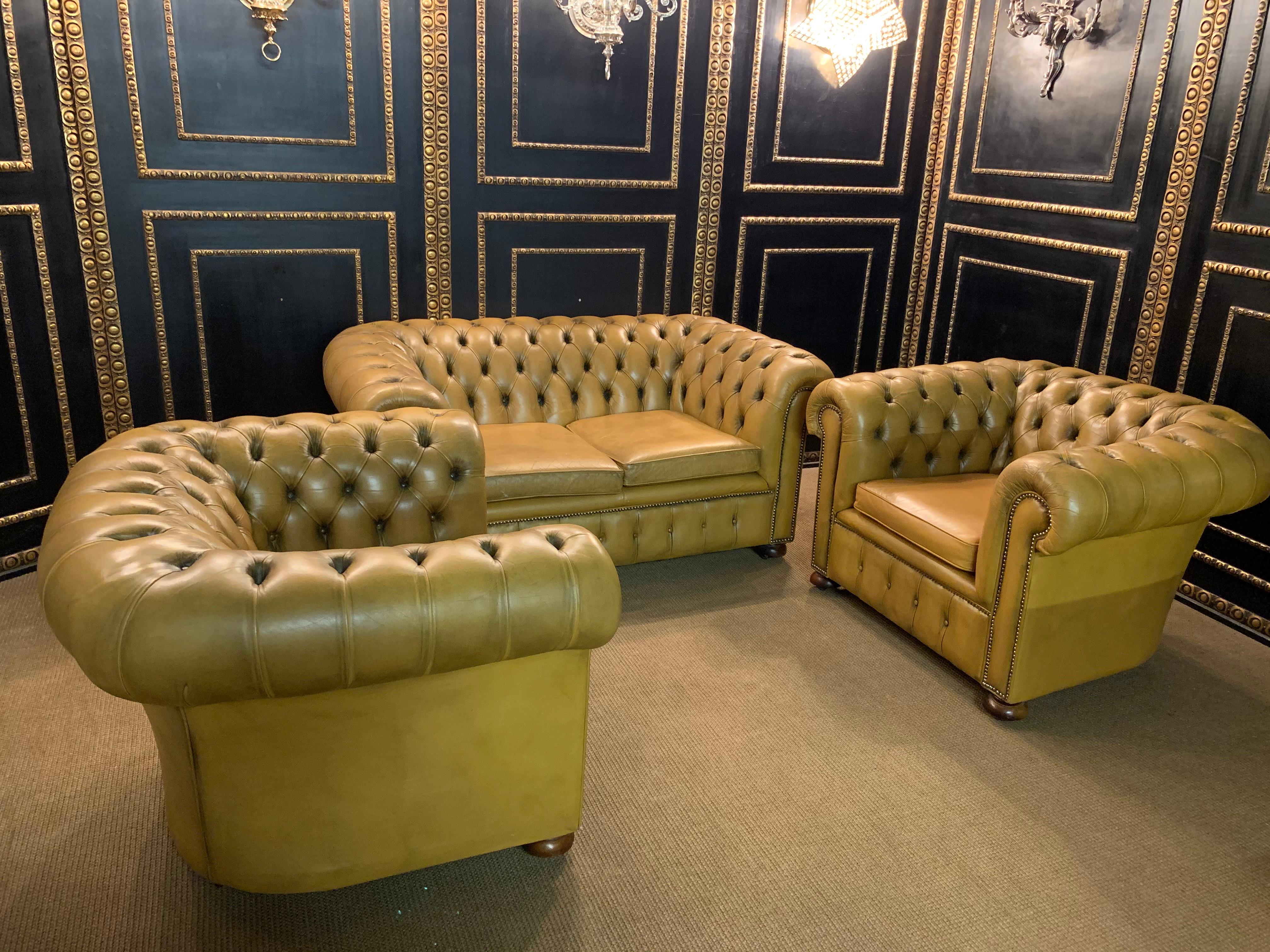 We are delighted to offer this stunning very rare handmade in England mustard yellow leather sofa and armchairs. Where to begin! This suite is absolute eye candy from every angle, it has the original leather hide, it has been hand dyed this lovely