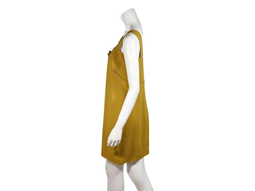 Product details:  Mustard yellow pleated shift dress by Oscar de la Renta.  Squareneck.  Sleeveless.  Concealed back zip closure.  36
