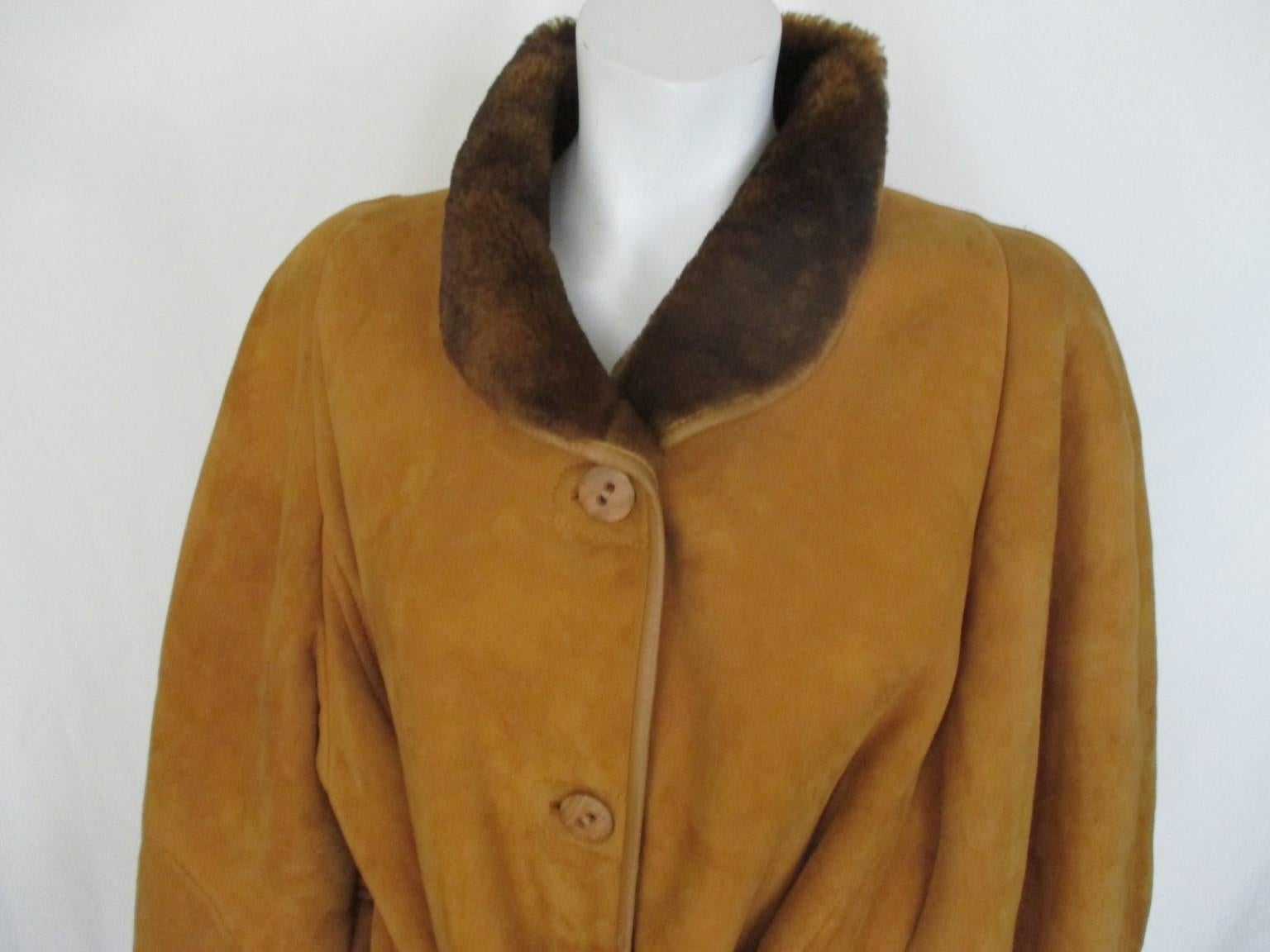 Super soft quality suede and warm lamb interior coat 

We offer more exclusive shearling and fur coats, view our frontstore.

Details:
Special mustard gold yellow  color, rare to find
It has 2 pockets, 1 inside zipper, inside belt and 4