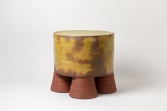 Mustarde, brown and  glazed ceramic  coffee table or stool  by Mia Jensen, 2024.