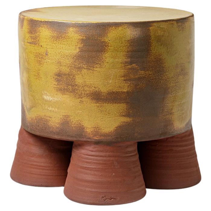 Mustarde, brown and  glazed ceramic  coffee table or stool  by Mia Jensen, 2024.