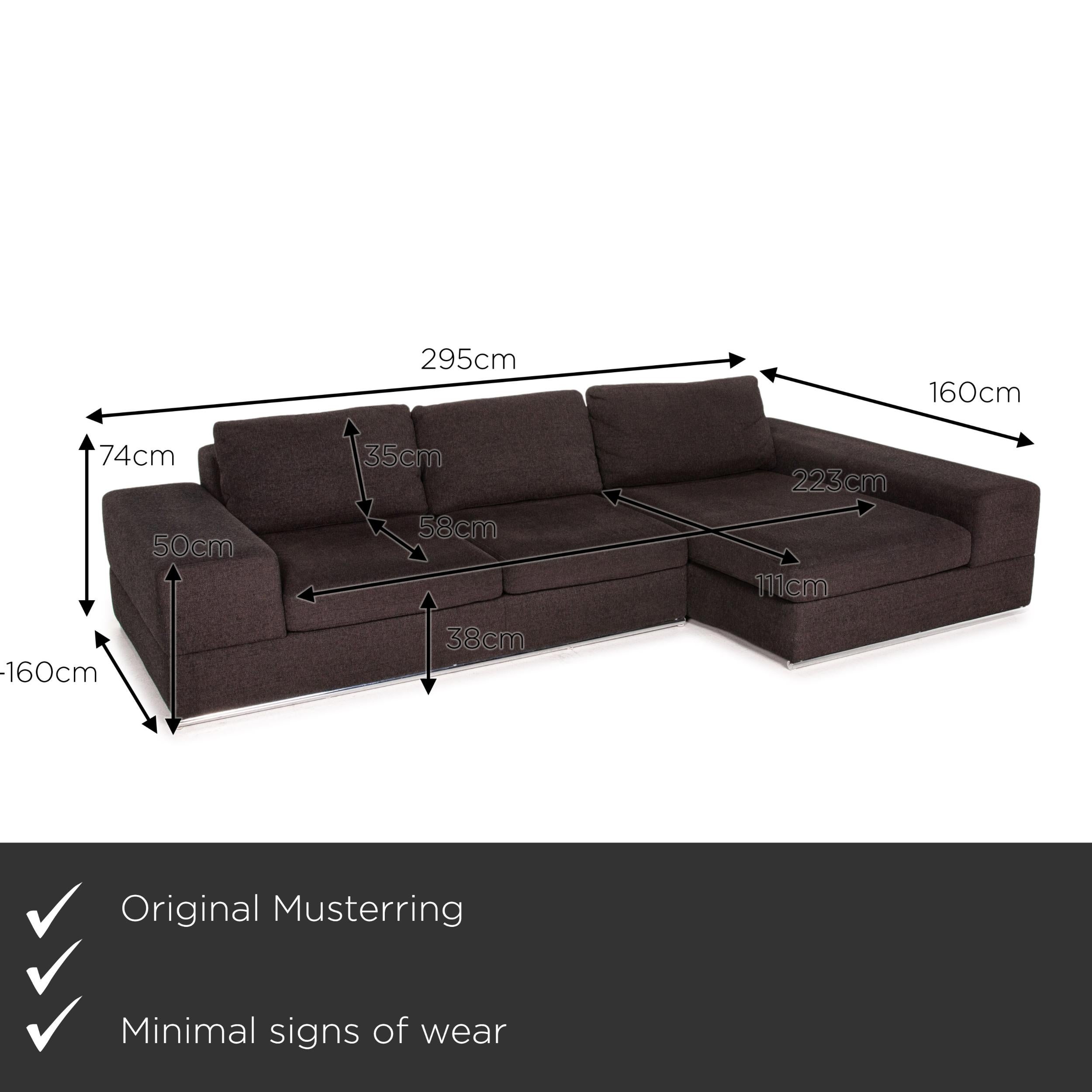 We present to you a Musterring fabric corner sofa brown dark brown couch.


 Product measurements in centimeters:
 

Depth: 108
Width: 295
Height: 74
Seat height: 38
Rest height: 50
Seat depth: 58
Seat width: 223
Back height: 35.
 