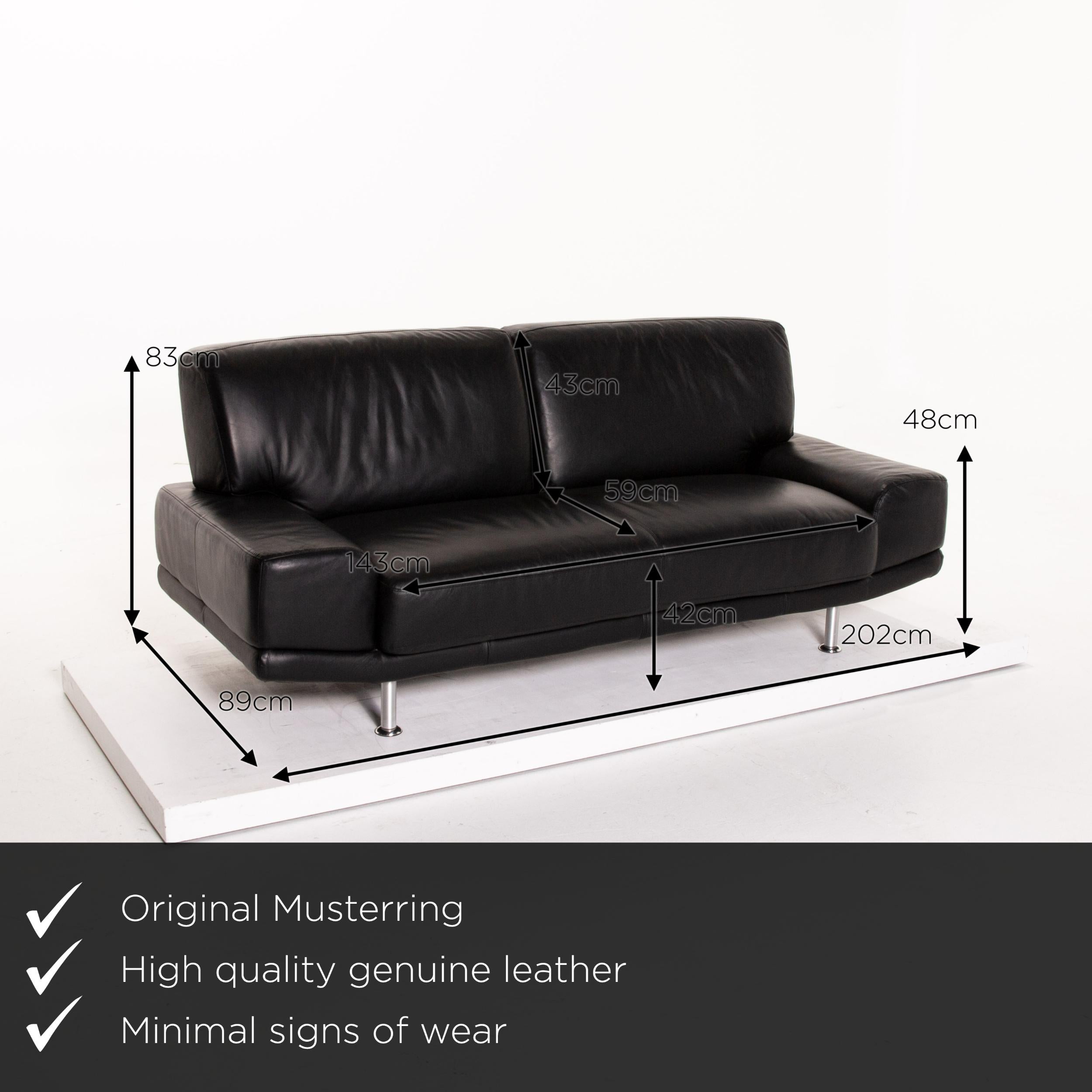 We present to you a Musterring leather sofa black two-seat couch.

 

 Product measurements in centimeters:
 

 Depth 89
 Width 202
 Height 83
 Seat height 42
 Rest height 48
 Seat depth 59
Seat width 143
 Back height 43.