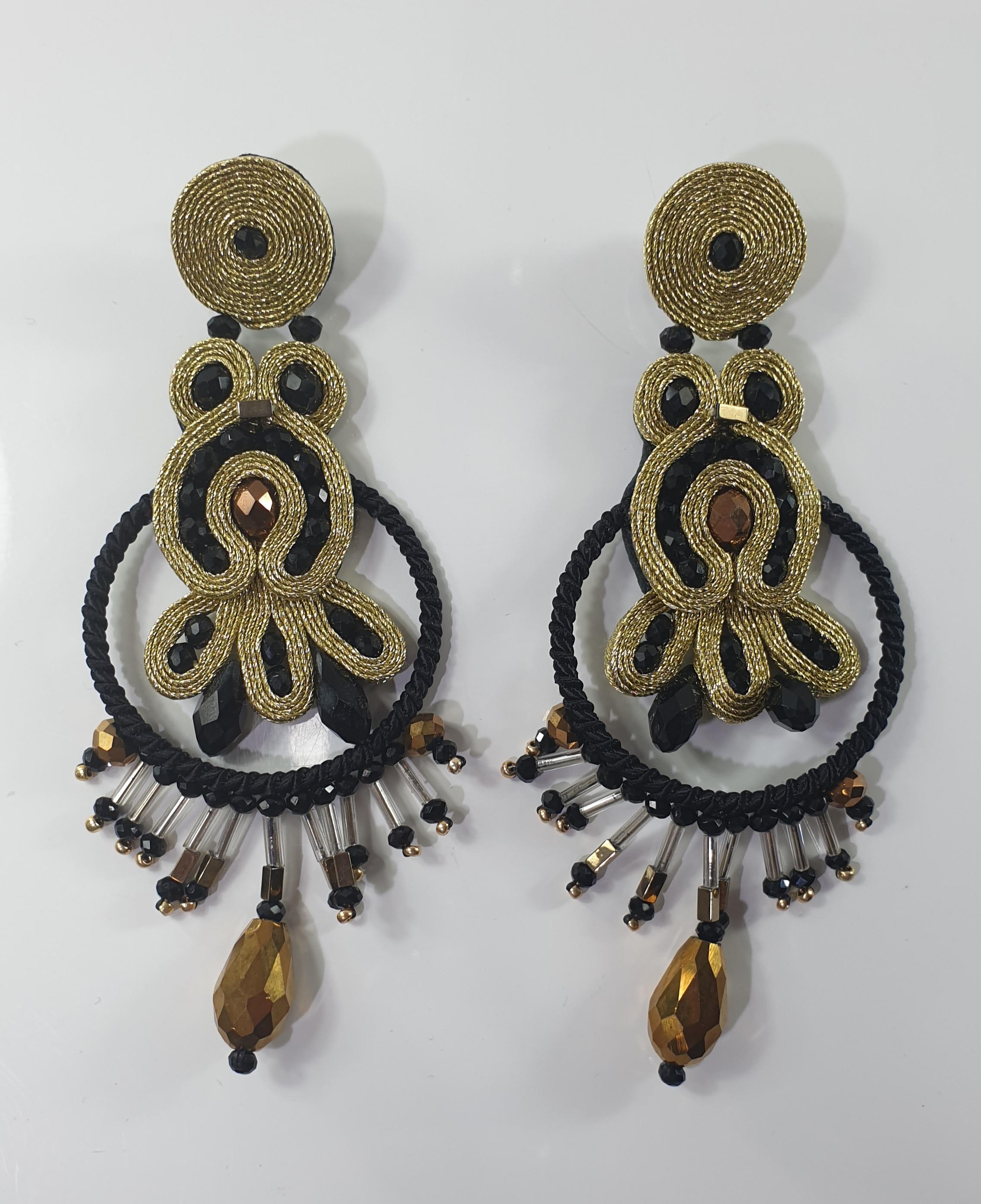 Musula Urban Golden Opera Earrings
Urban Collection is a special homage to sweet lovers.
Soutache earrings made with rayon 2mm, hematites and crystal beads. 
Silver clips lenght 10cm 3.94inches. 
Back finish in natural smooth and thin