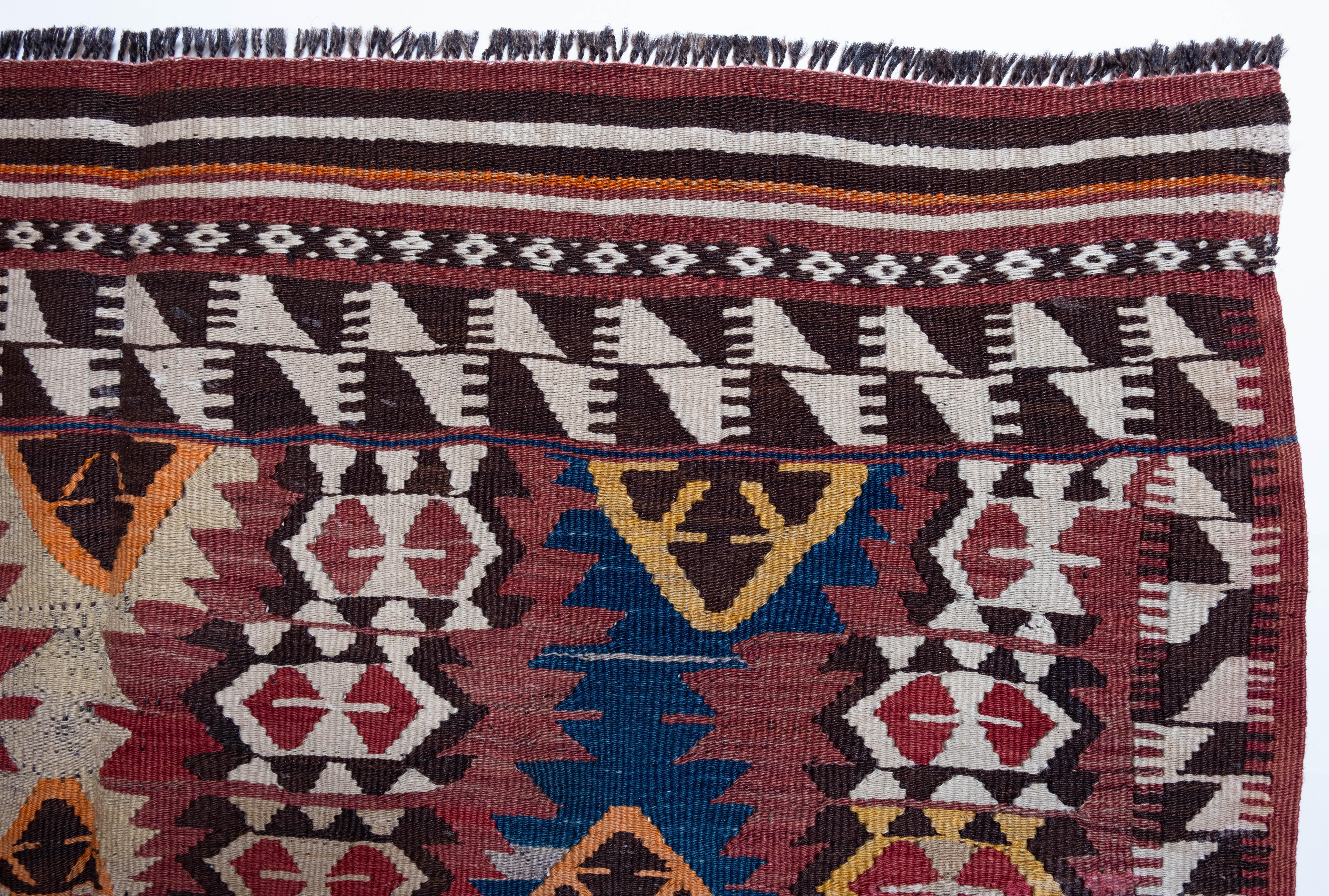 This is Eastern Anatolian Old Vintage Kilim from the Mut, Adana region with a rare and beautiful color composition. 

This highly collectible antique kilim has wonderful special colors and textures that are typical of an old kilim in good condition.
