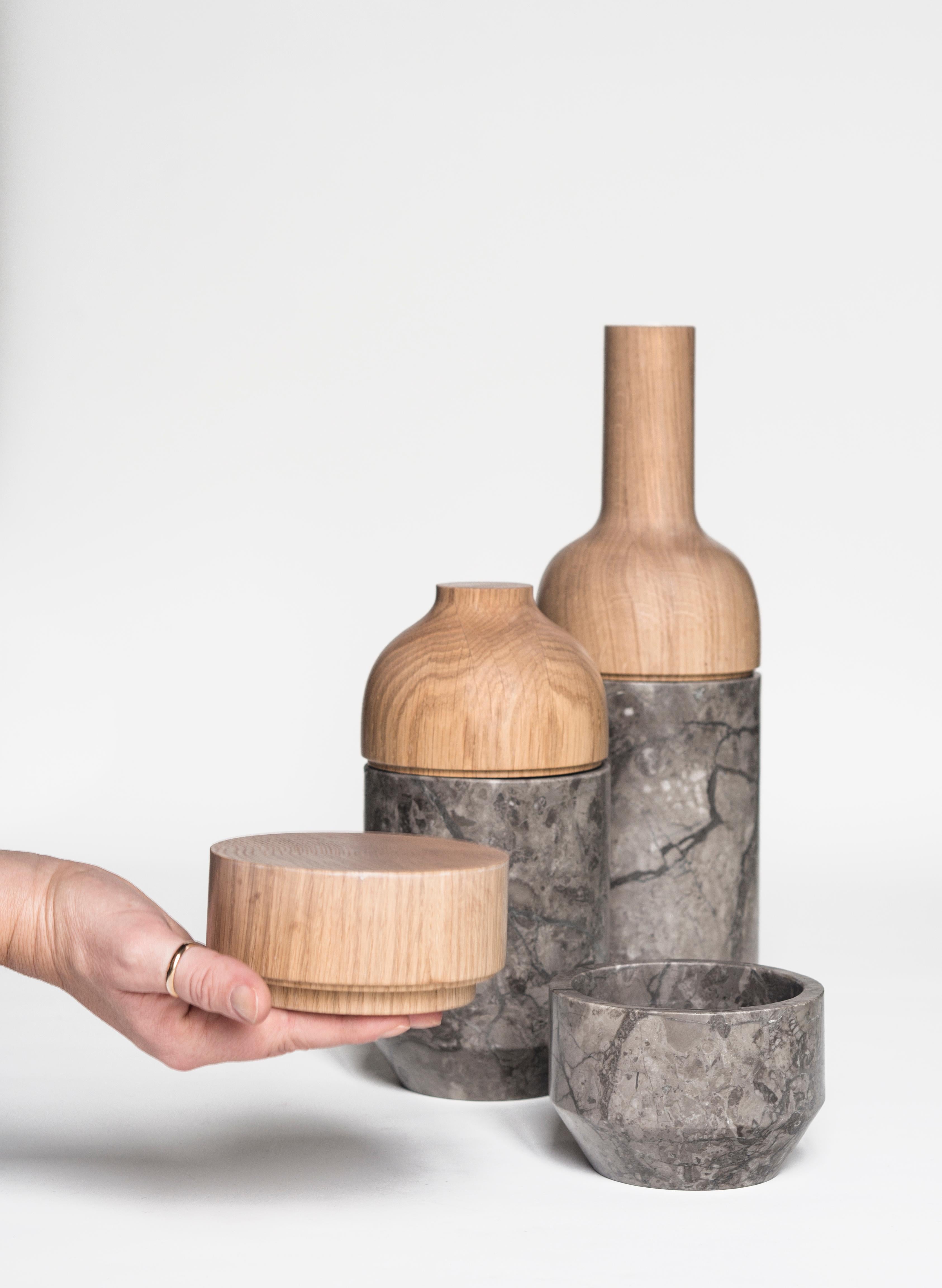 Aggregated stone by geological stratifications and natural wood form an emotional collection of containers that have in their being the becoming. Formal interpretation of the individual's condition, which through experience defines its essence. The