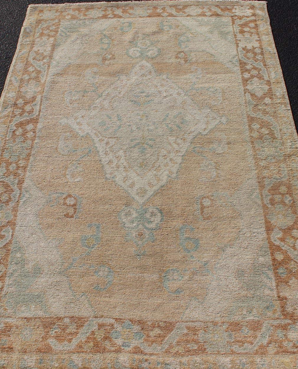 Wool Muted Colored Turkish Oushak Rug is Subdued Medallion Design For Sale