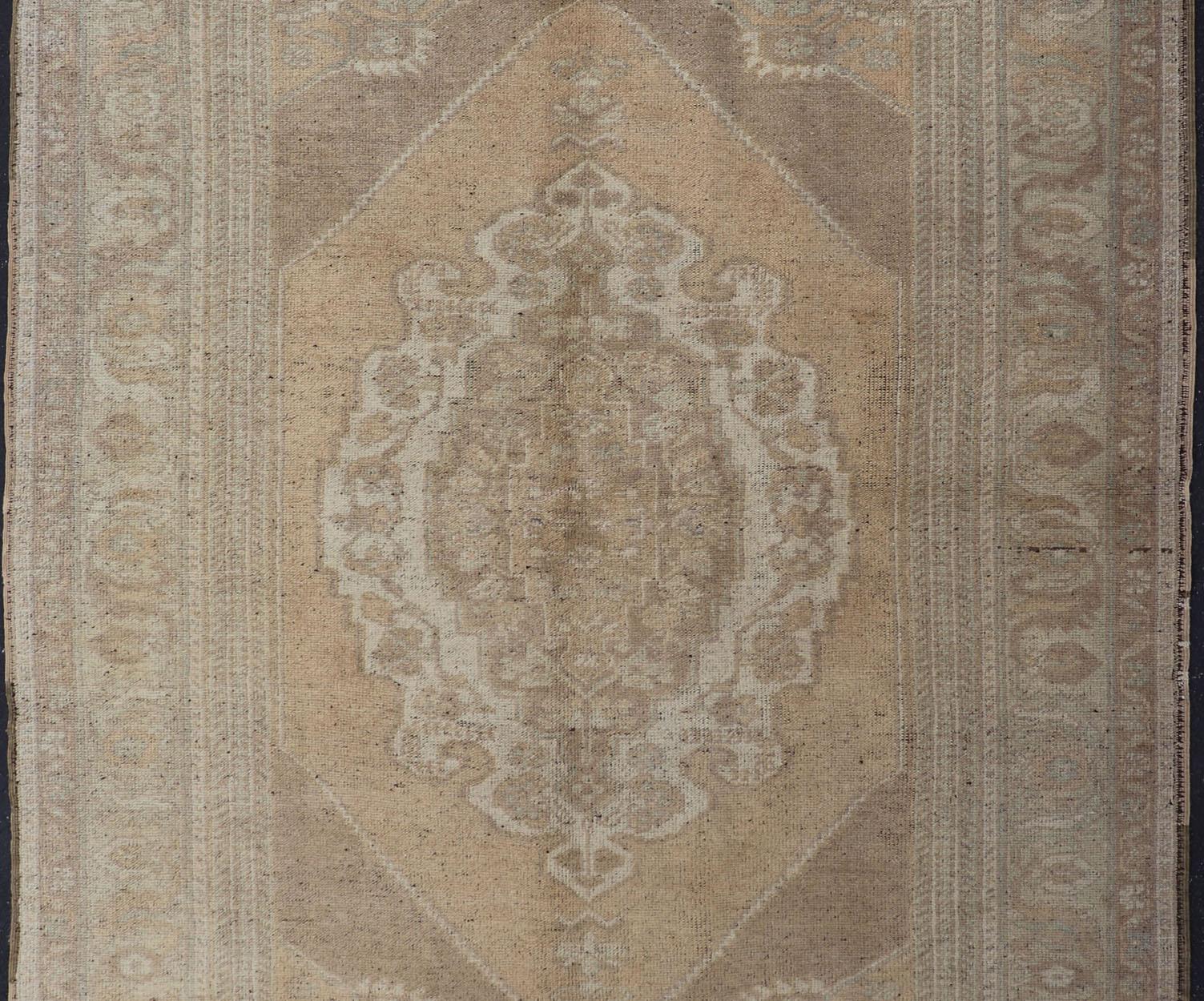 Hand-Knotted Muted Colors Vintage Turkish Oushak Rug with Medallion Design in Lt. Green For Sale