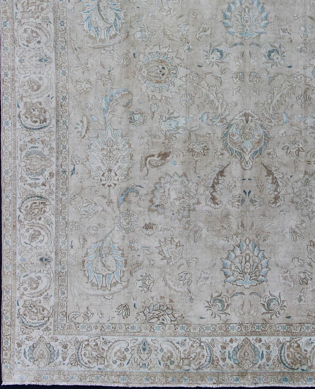 Muted gray, blue, and ivory vintage Persian Tabriz rug with floral design, hd-tra, country of origin / type: Iran / Tabriz, circa 1950

This vintage Persian Tabriz carpet (circa mid-20th century) features both muted and faded colors and a medallion