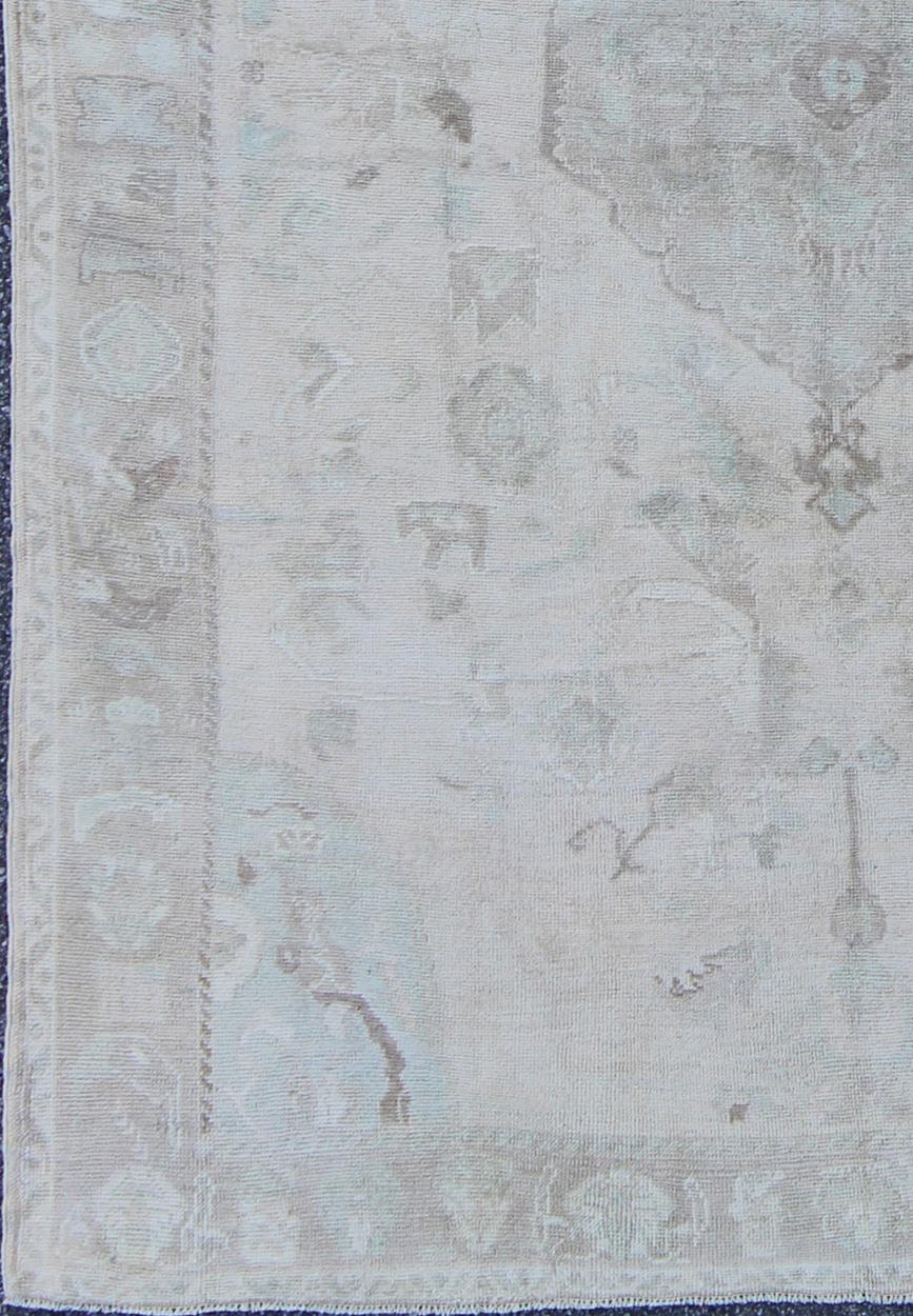Hand-Knotted Muted Layered Medallion Vintage Turkish Oushak Rug in Taupe, Lt Blue, and Brown For Sale