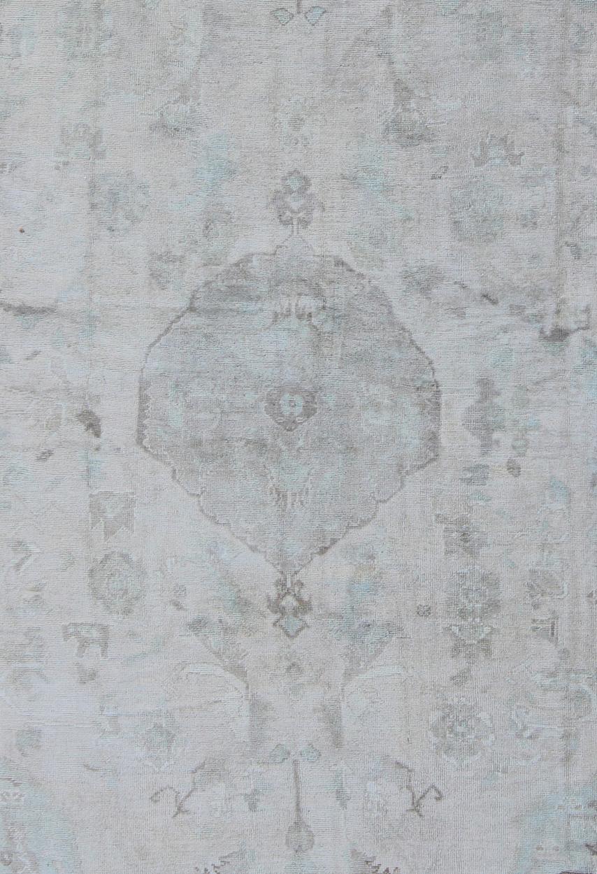 Muted Layered Medallion Vintage Turkish Oushak Rug in Taupe, Lt Blue, and Brown In Good Condition For Sale In Atlanta, GA