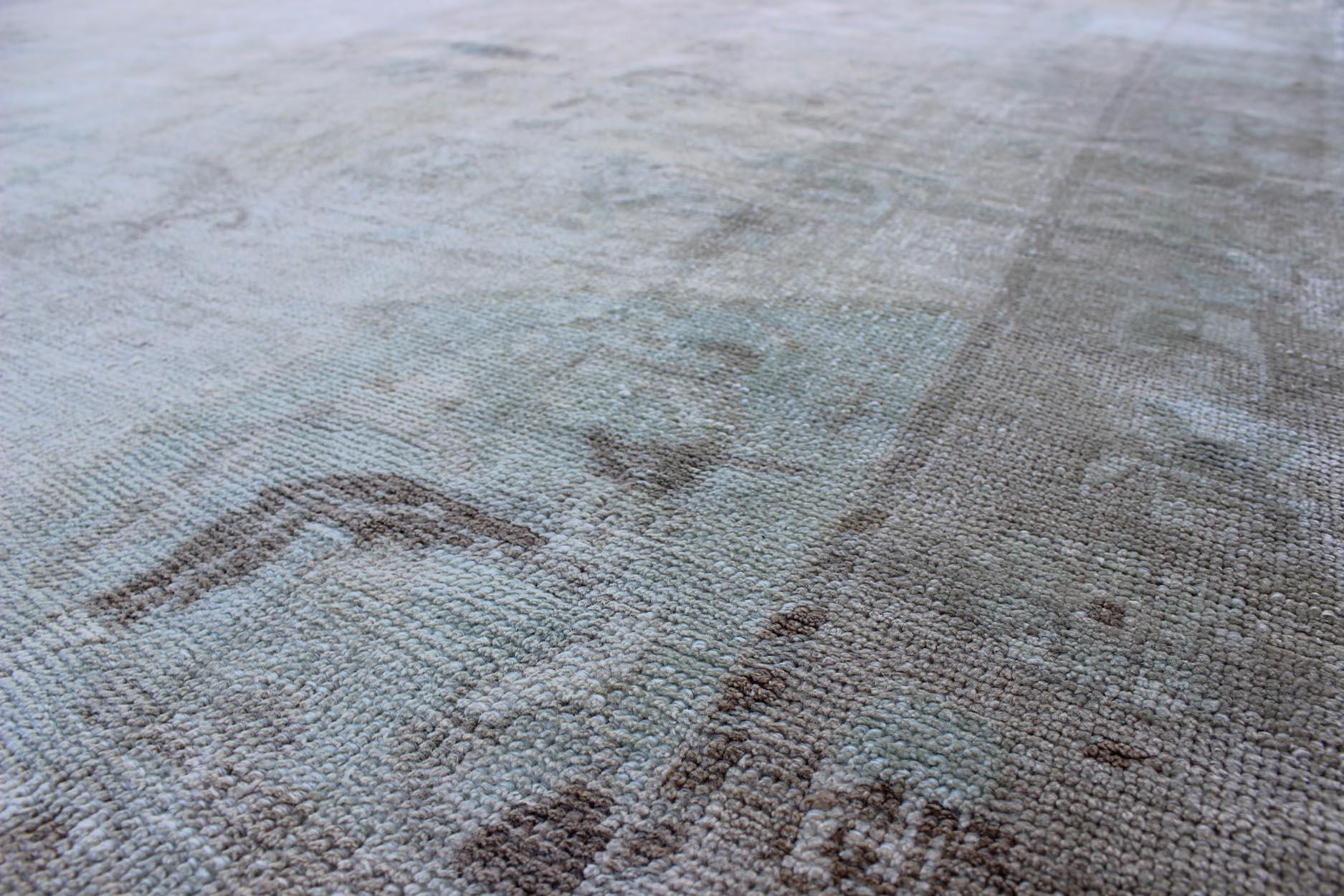 20th Century Muted Layered Medallion Vintage Turkish Oushak Rug in Taupe, Lt Blue, and Brown For Sale