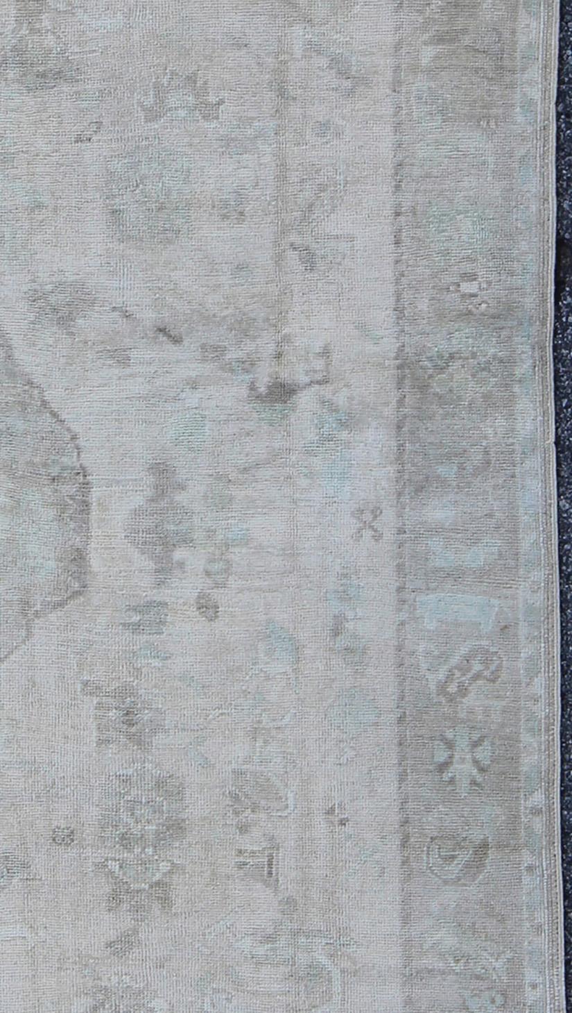 Wool Muted Layered Medallion Vintage Turkish Oushak Rug in Taupe, Lt Blue, and Brown For Sale