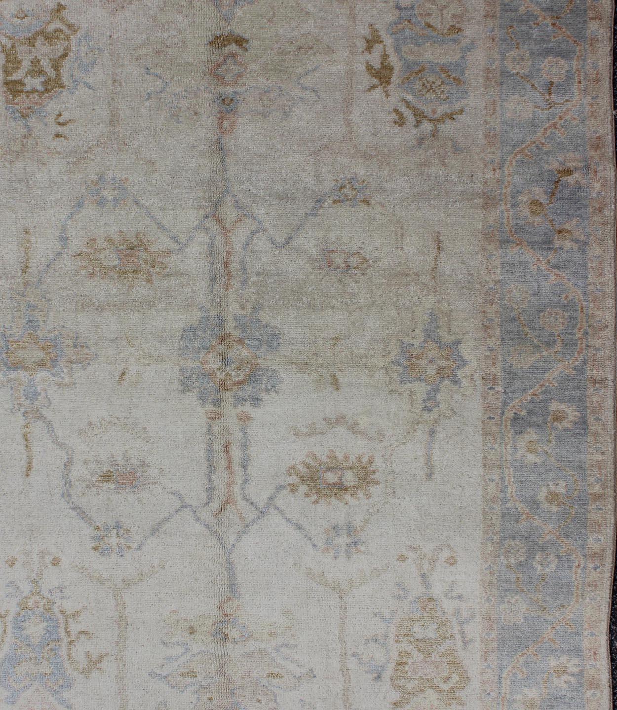 Muted Oushak hand knotted rug in light blue, ivory/white & light brown, Rug/BDH-711189, country of origin / type: India / Oushak

Measures: 4'3 x 5'9