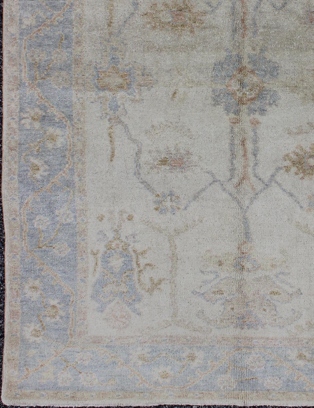 Indian Muted Oushak Rug in Blue, Light Brown, and White For Sale