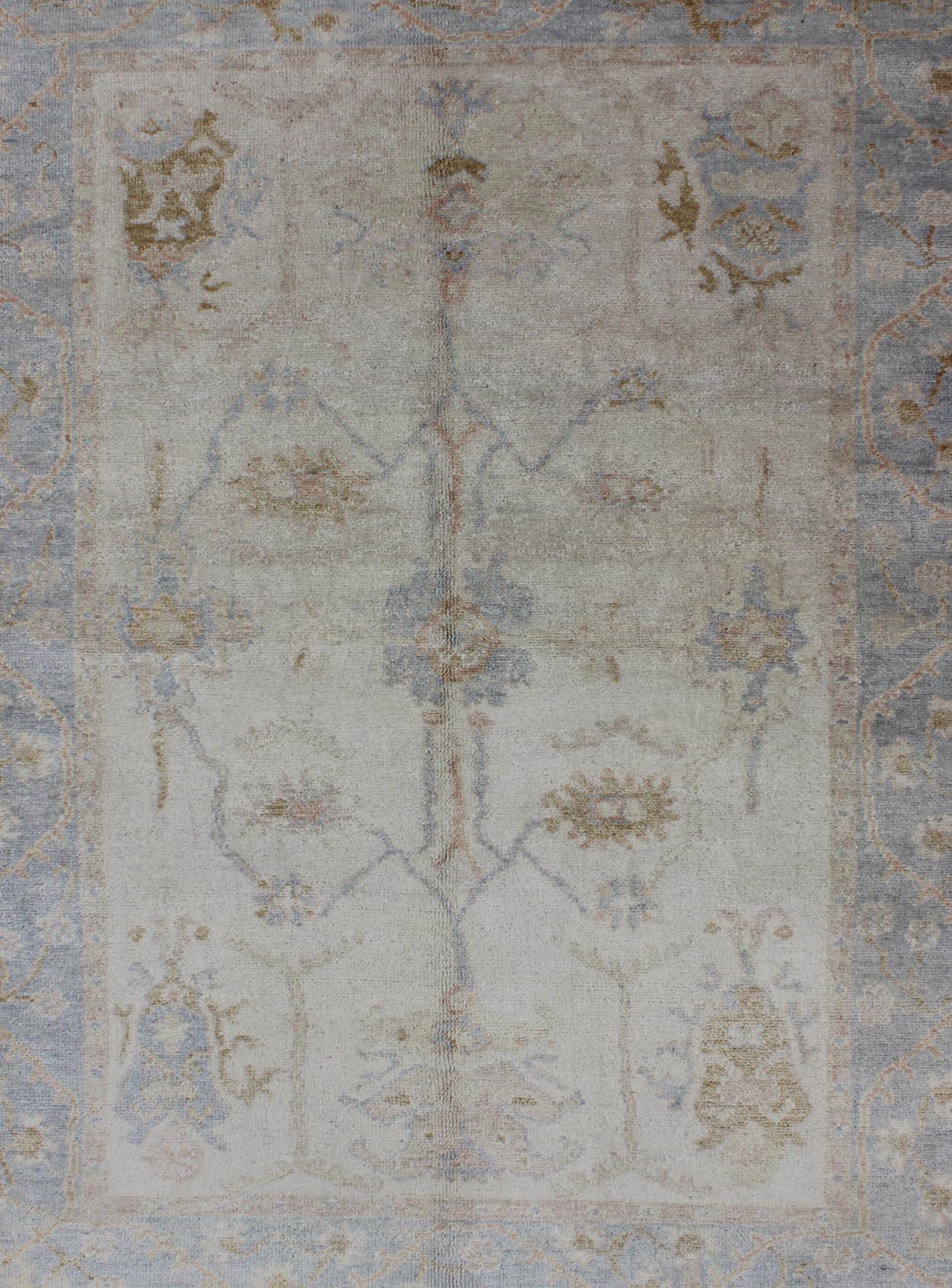 Hand-Knotted Muted Oushak Rug in Blue, Light Brown, and White For Sale