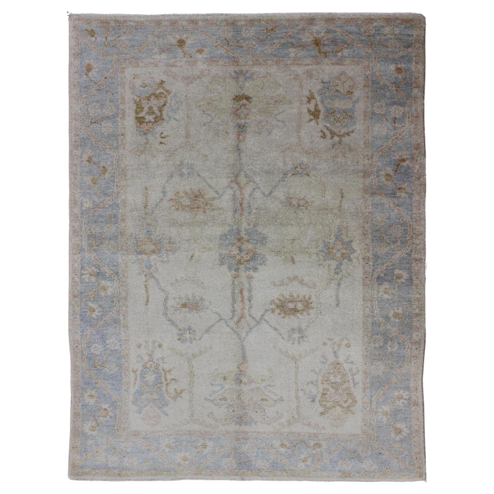 Muted Oushak Rug in Blue, Light Brown, and White
