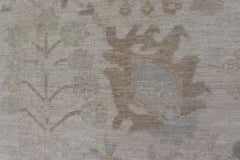 Muted Oushak Rug with Sand Field and Light Blue and Soft Green Accents