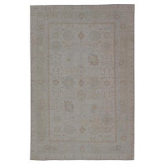 Muted Oushak Rug with Sand Field and Light Blue and Soft Green Accents