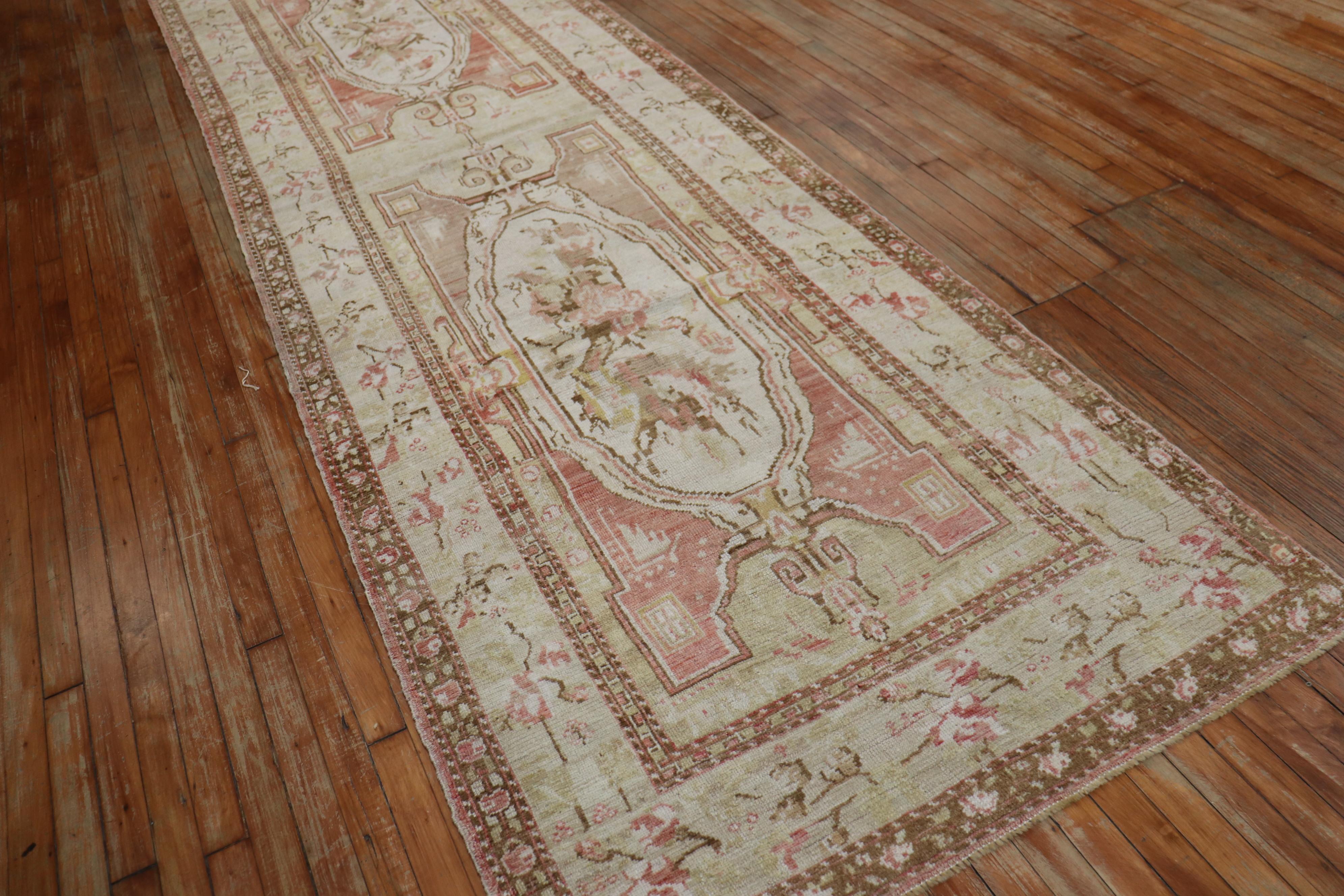 An early 20th century muted Turkish Ghiordes wide runner.

Measures: 3'11