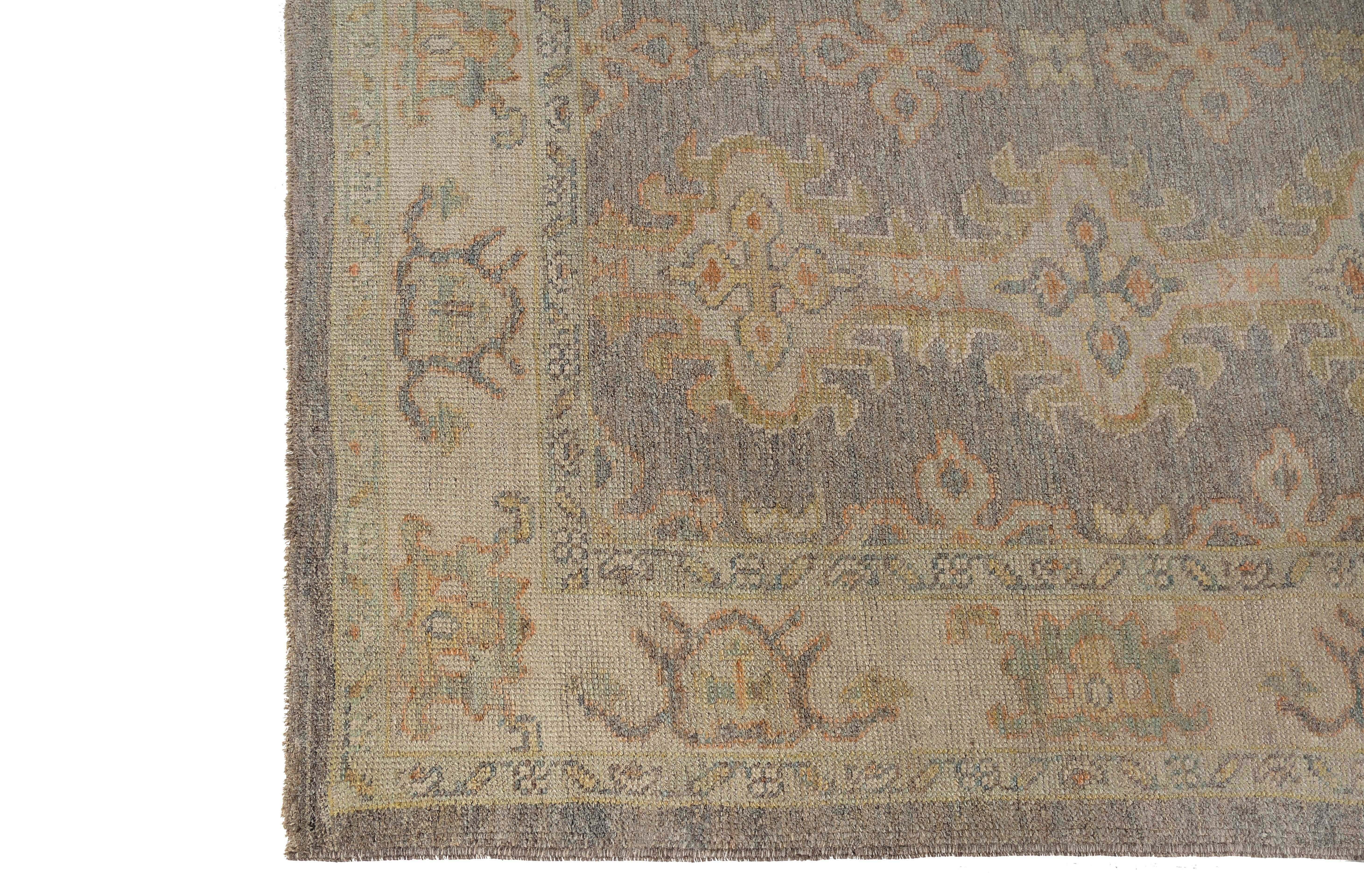 Introducing a stunning handmade Turkish Oushak rug, measuring 6'8X9'1