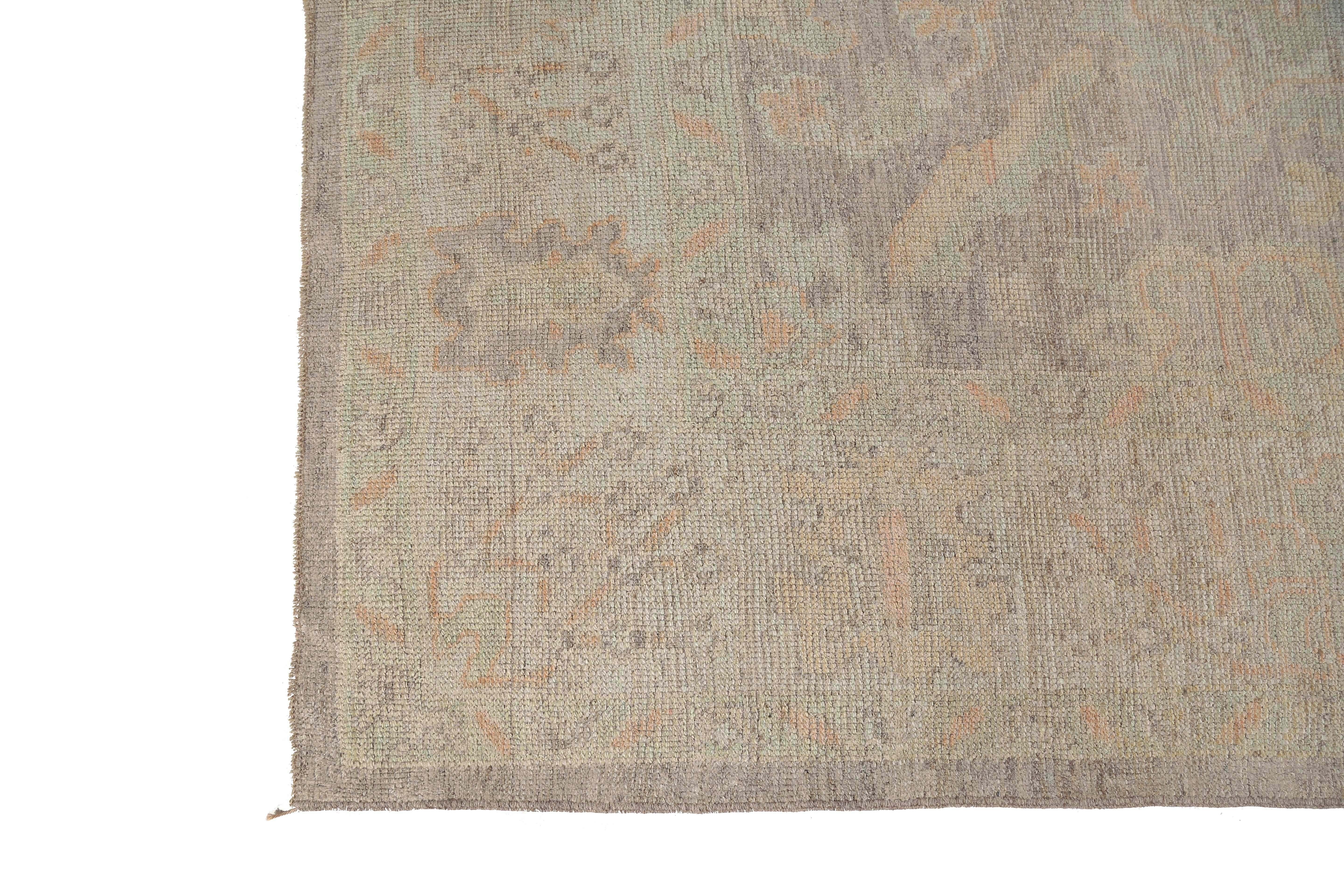 Introducing our exquisite Turkish Oushak rug, a true masterpiece of handmade craftsmanship. Measuring 6'6X10'4