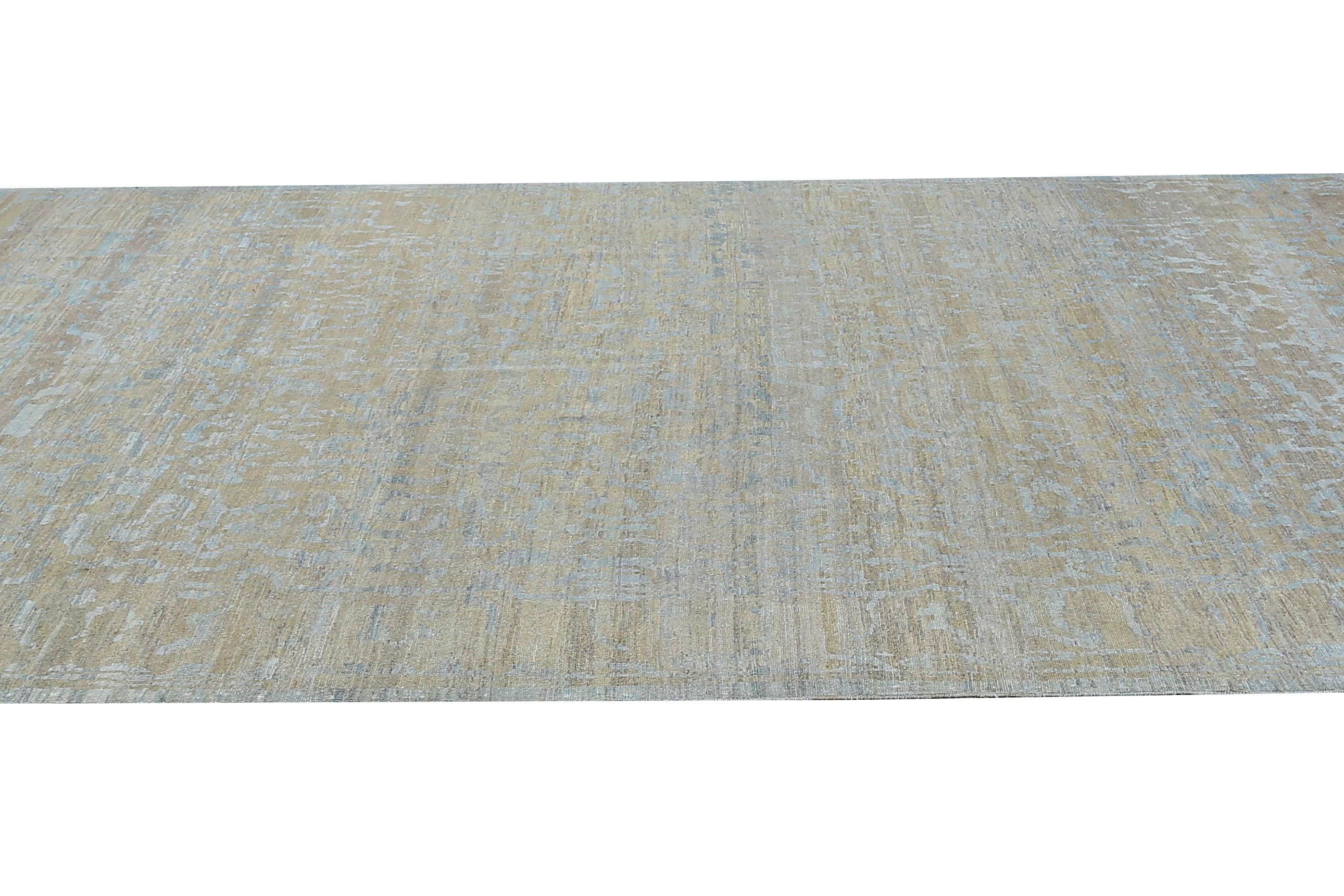 Our Turkish Sultanabad rug in the size of 10'2'' x 14'0'' is a subtle yet sophisticated piece that will complement any decor. Handcrafted by skilled artisans using high-quality wool, this rug features muted blue and grey tones, creating a calming