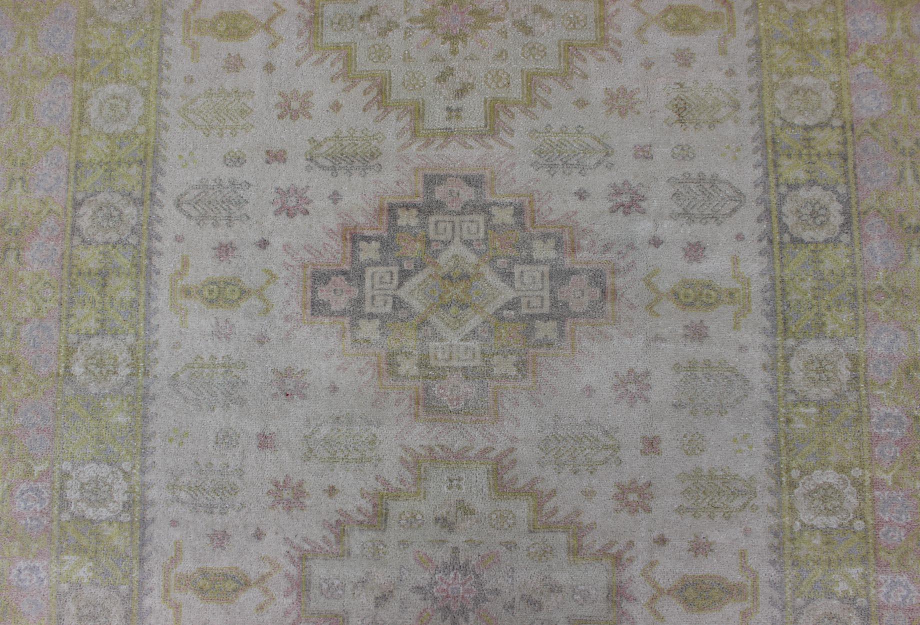 Muted Vintage Spanish Rug with Elegant Tri-Medallion Design and Floral Motifs In Good Condition For Sale In Atlanta, GA