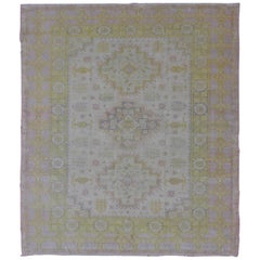 Muted Vintage Spanish Rug with Elegant Tri-Medallion Design and Floral Motifs