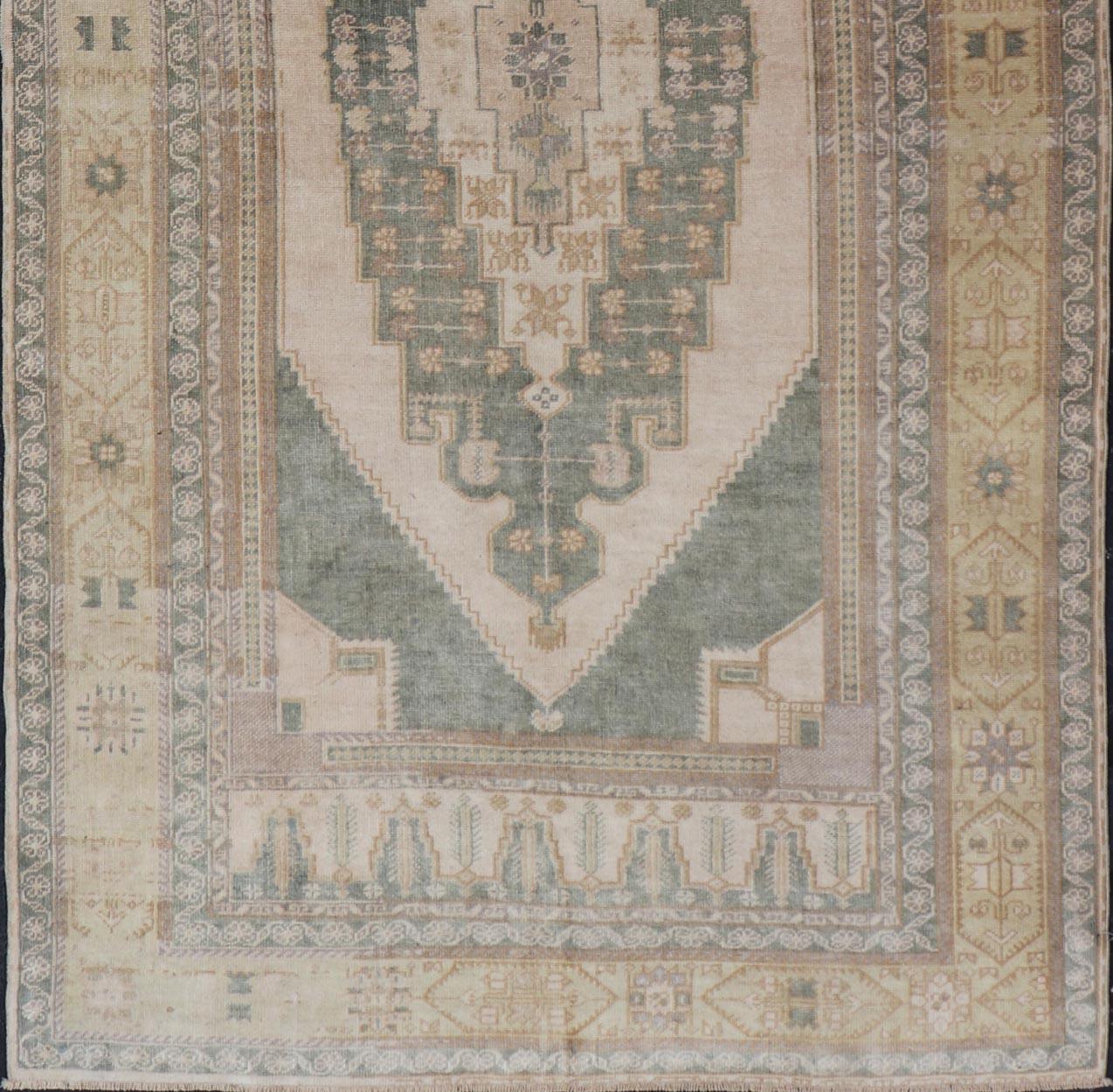 Muted Vintage Turkish Oushak in Wool with Sub-Geometric Medallion Design 1