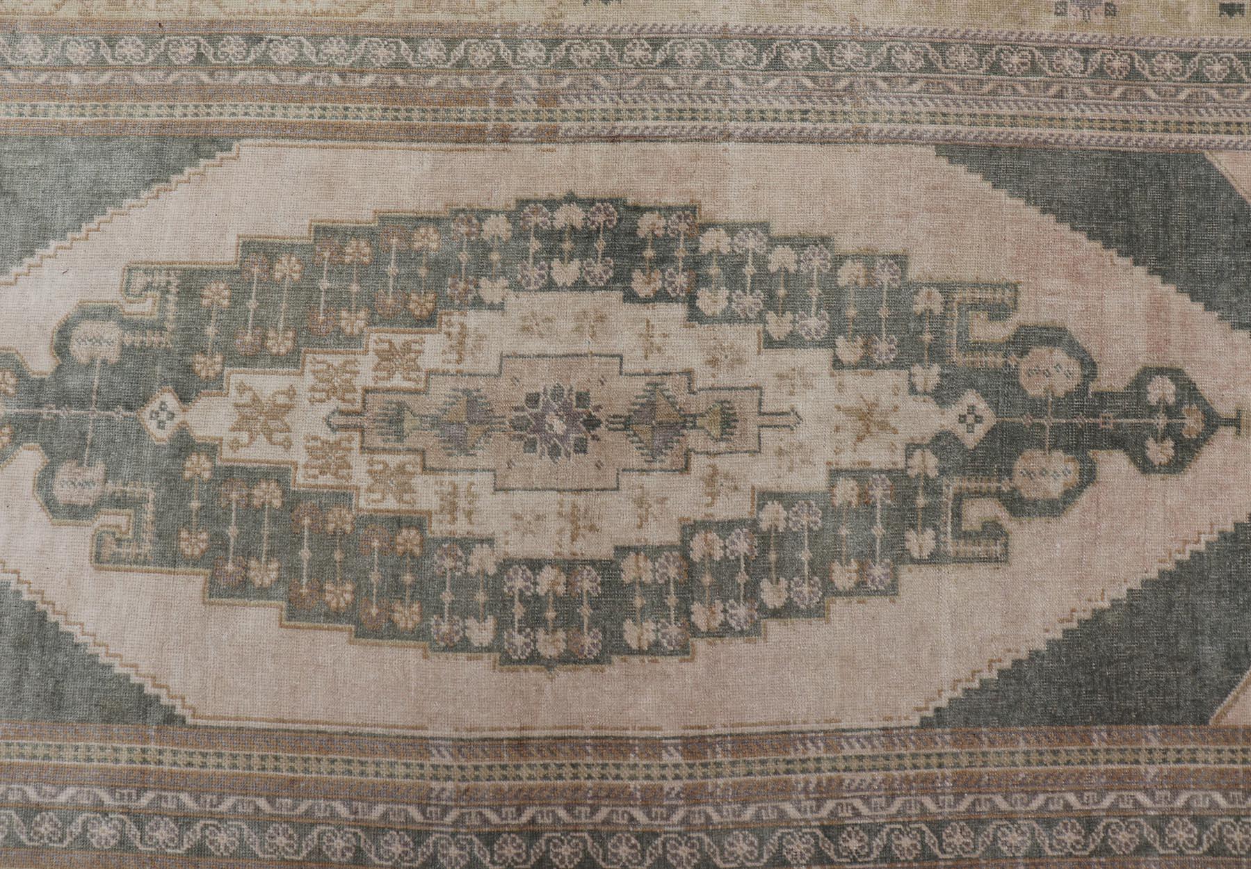 Muted Vintage Turkish Oushak in Wool with Sub-Geometric Medallion Design 4