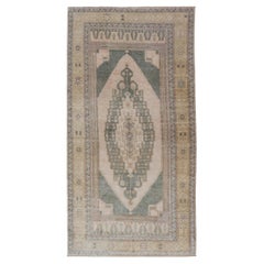 Muted Vintage Turkish Oushak in Wool with Sub-Geometric Medallion Design