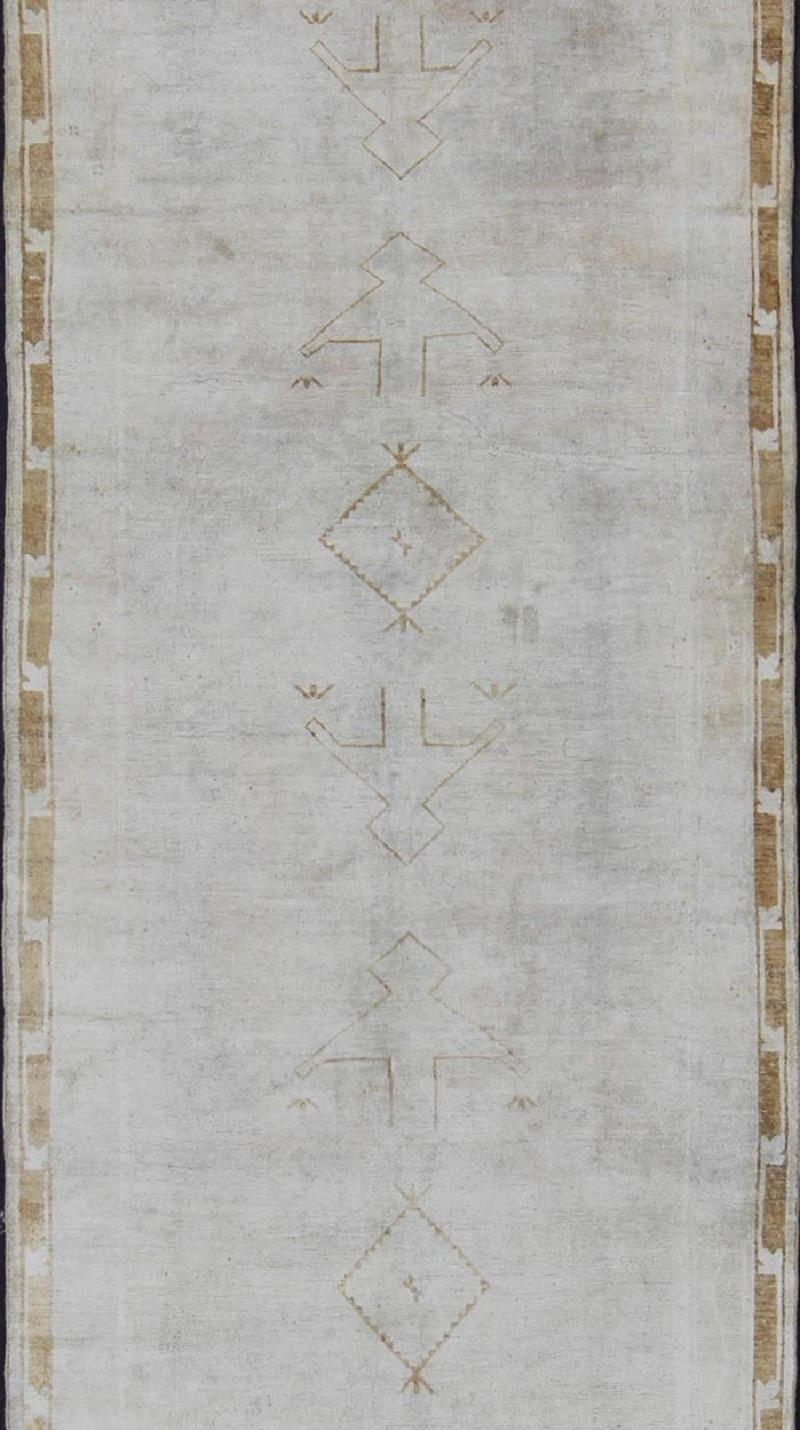 Hand-Knotted Muted Vintage Turkish Oushak Runner a Faint Tribal Design For Sale