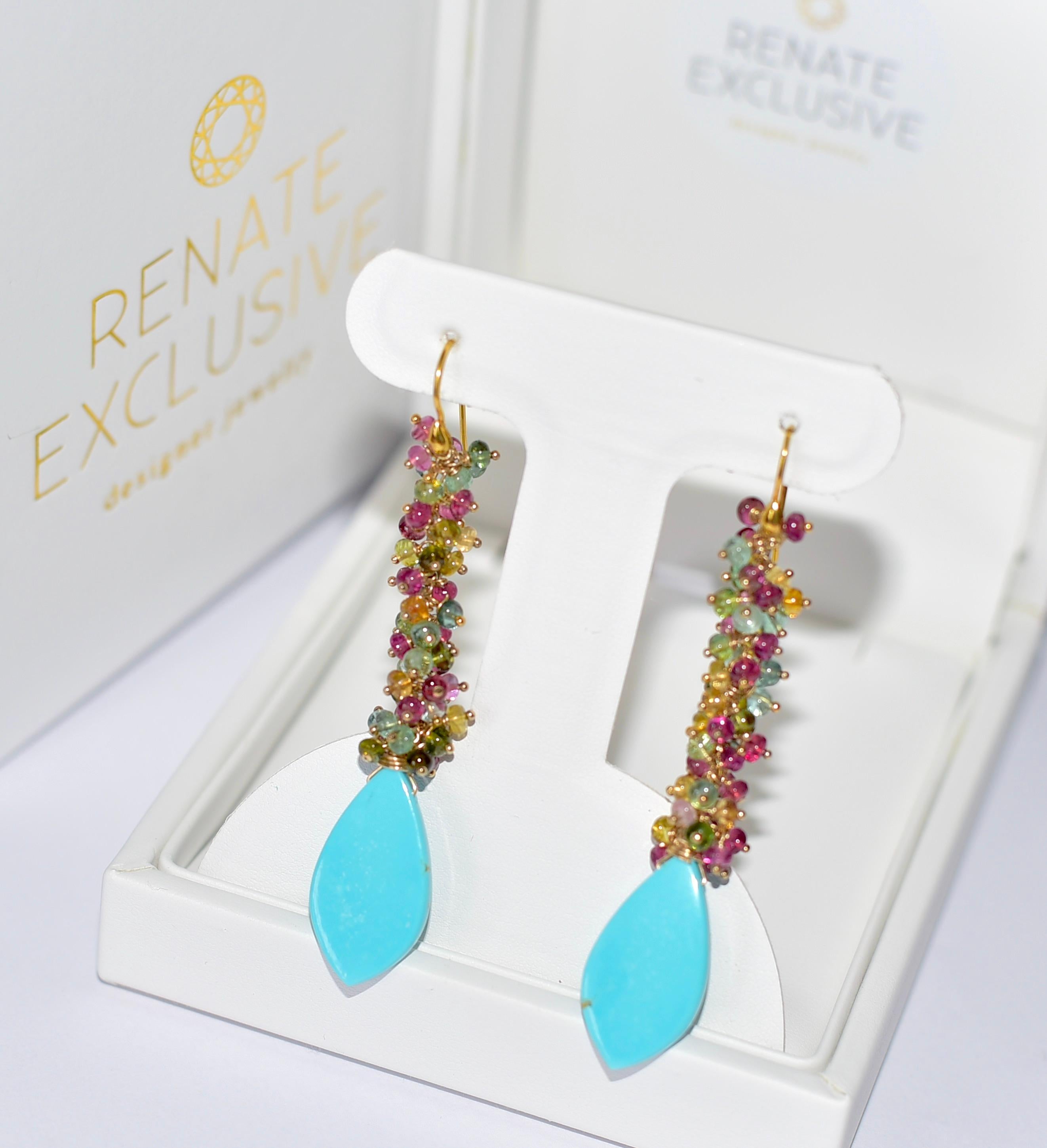 These earrings are a stunning mix of summer garden colors - these sinewy earrings are so gorgeous and fun to wear! A mix of turquoise and colorful tourmalines reminds me of a perfect getaway to the Caribbean!