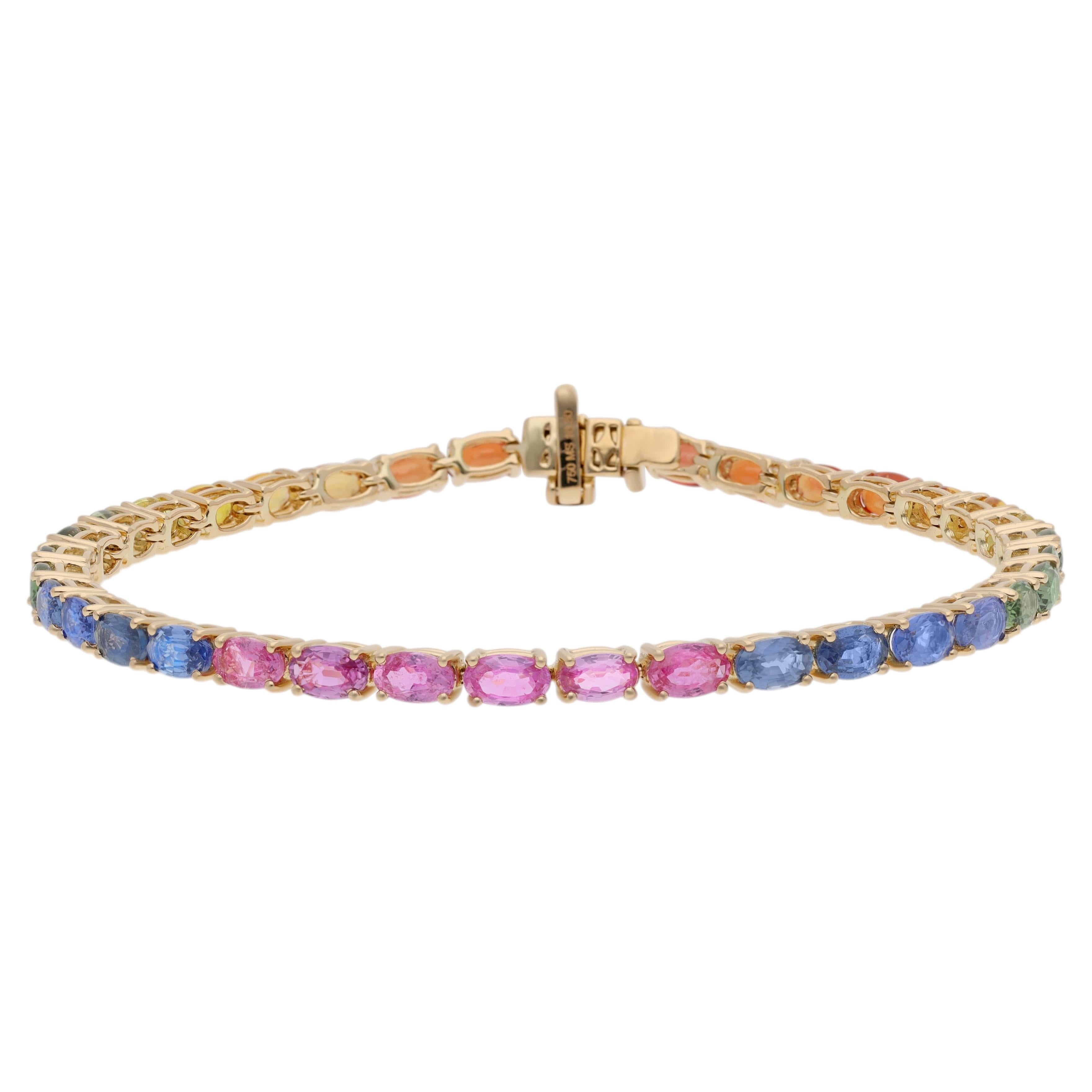 Conjunto de pulsera con varios zafiros engastados en oro amarillo de 18 quilates