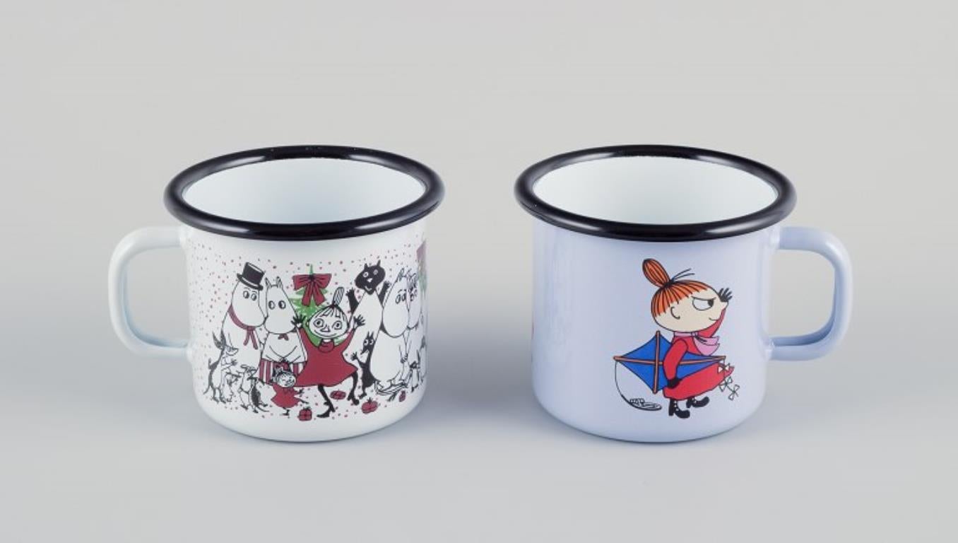 Muurla, Finland. 
Four enamel mugs with different motifs from the Moomin stories.
2000s.
Marked.
Perfect condition.
Dimensions: D 8.5 cm without handle x H 7.0 cm.