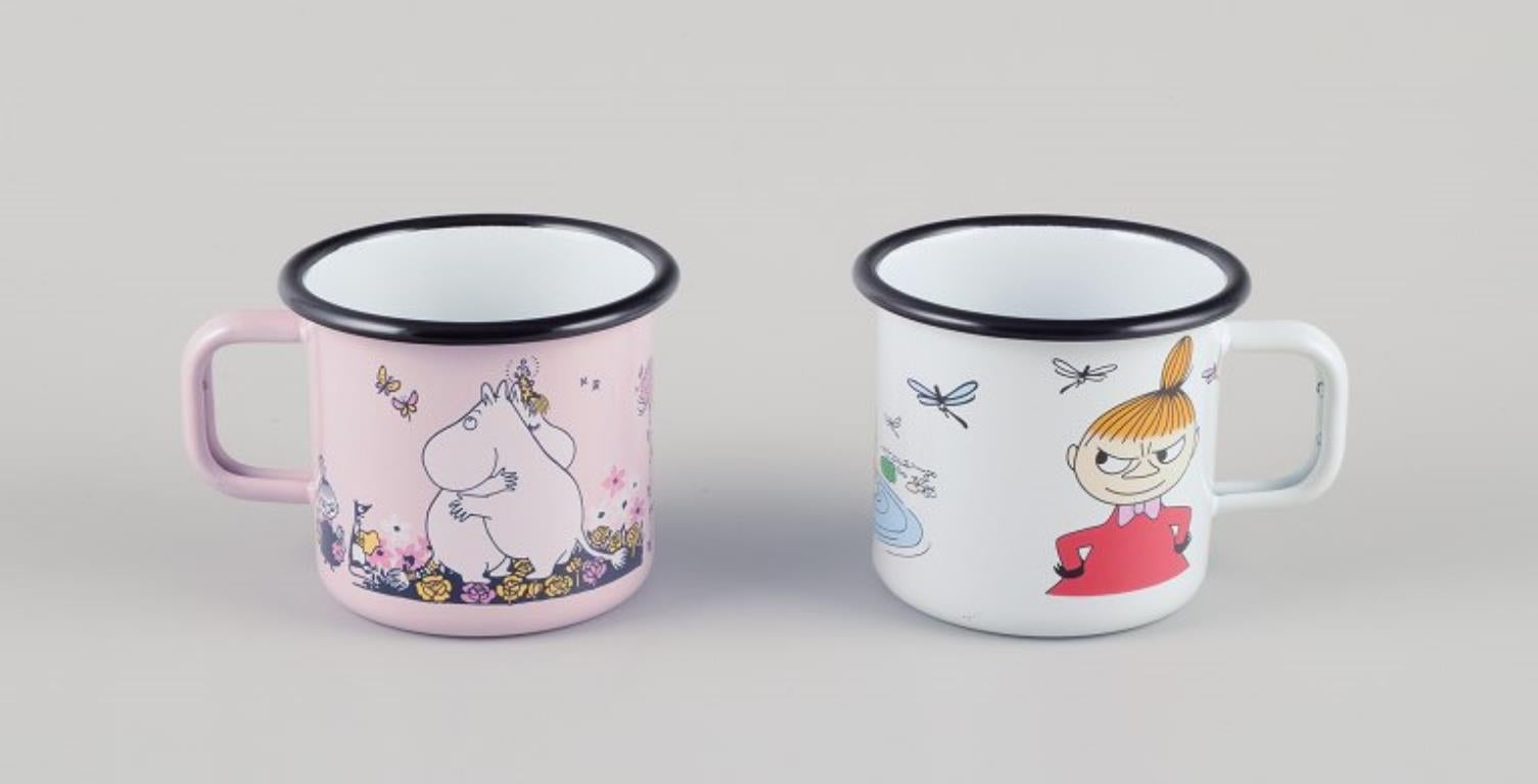 Muurla, Finland. 
Four enamel mugs with different motifs from the Moomins stories.
2000s.
Marked.
Perfect condition.
Dimensions: D 8.5 cm without handle x H 7.0 cm.