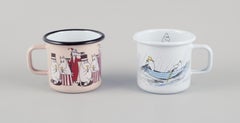 Muurla, Finland. Four enamel mugs with motifs from the Moomins stories, 21st C