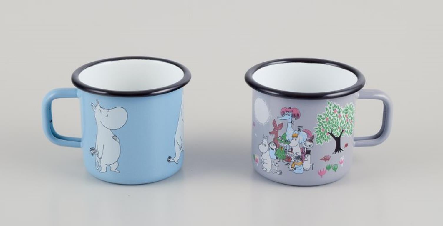 Muurla, Finland. Four enamel mugs with motifs from the Moomins stories, 21st C In Excellent Condition For Sale In Copenhagen, DK
