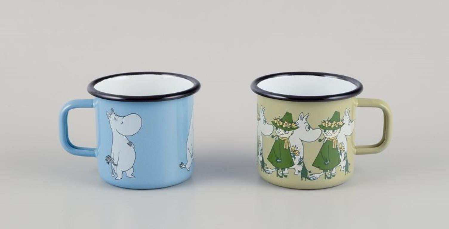 Muurla, Finland. 
Four enamel mugs with different motifs from the Moomintroll stories.
2000s.
Marked.
Perfect condition.
Dimensions: D 8.5 cm without handle x H 7.0 cm.