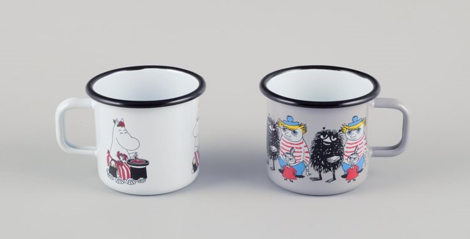 Muurla, Finland. 
Four enamel mugs with different motifs from the Moomintroll stories.
2000s.
Marked.
Perfect condition.
Dimensions: D 8.5 cm without handle x H 7.0 cm.